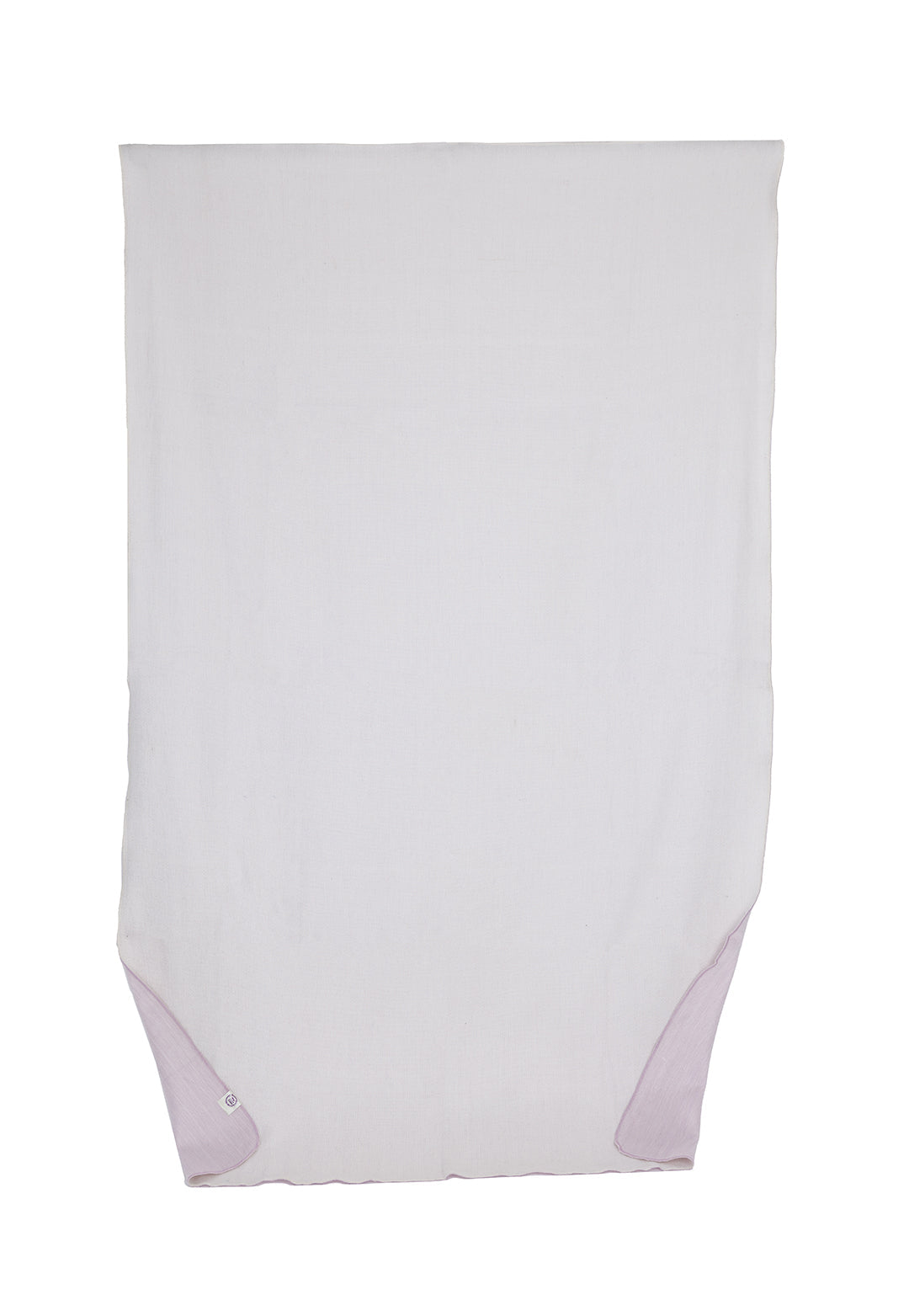 white throw blanket laid flat with pale pink corner accents