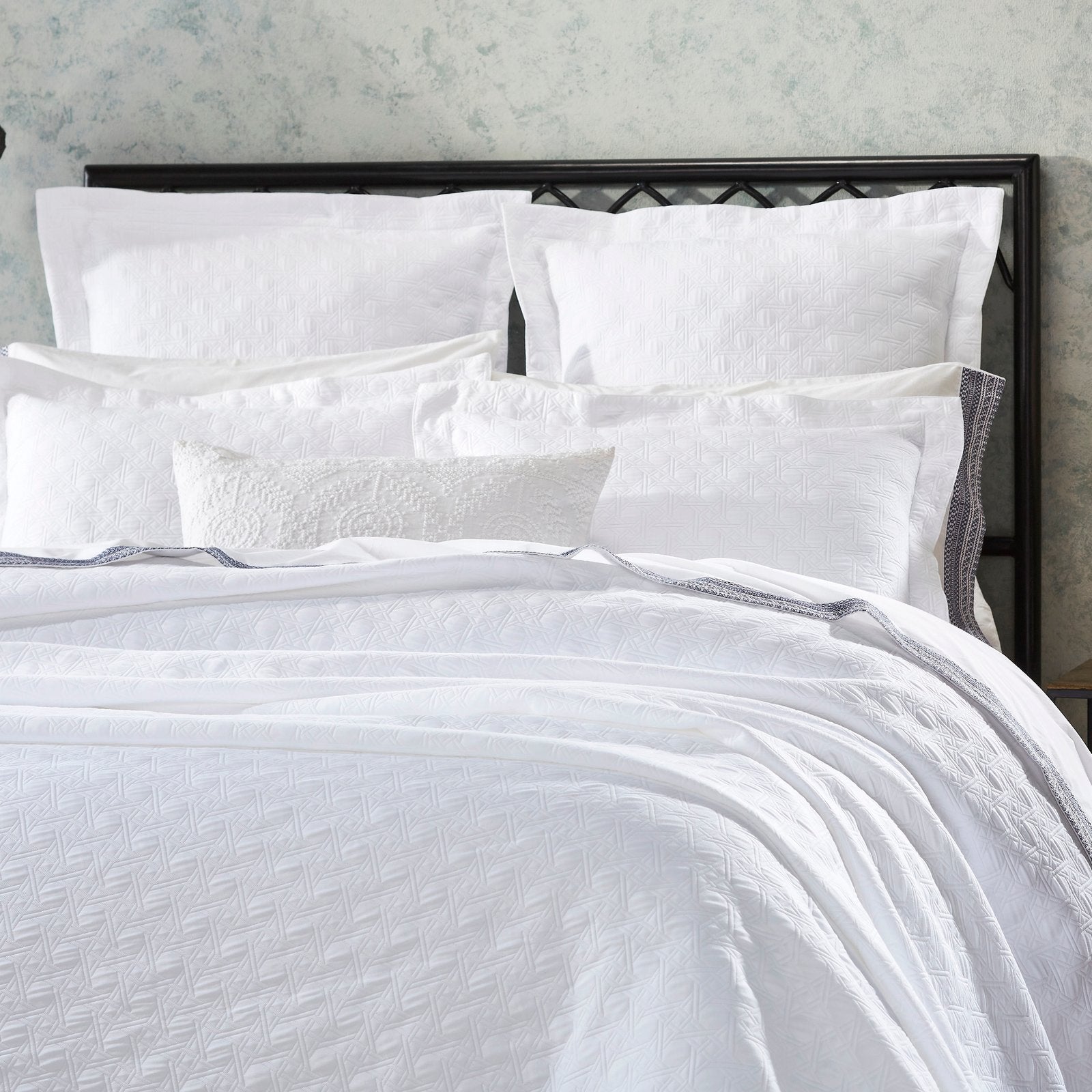 CL-175-X_2|Pristine white quilted Euro sham, intricately patterned for depth and visual interest, complementing any modern bed ensemble.