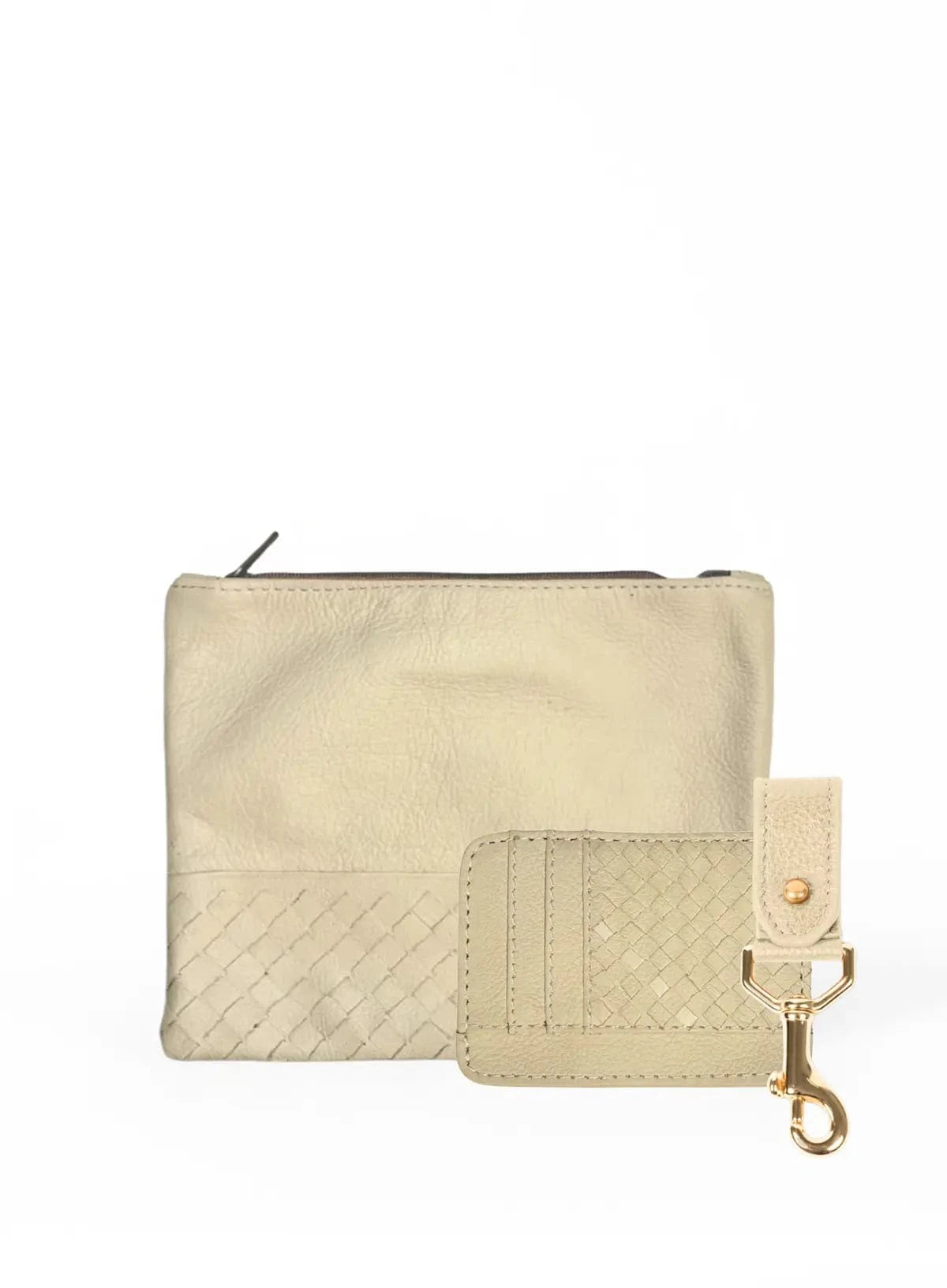 The small and large bone woven pouches from the spring/summer collection held by model sitting down. 