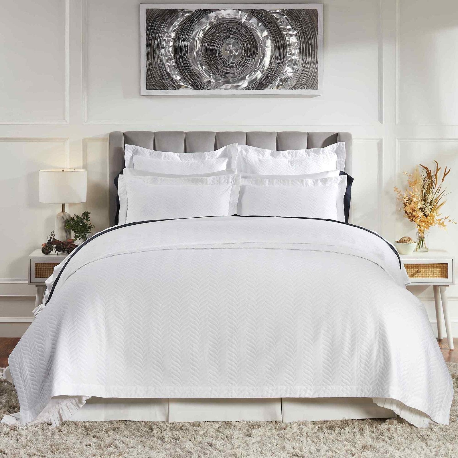 CL-194-X_1|Elegant white chevron textured quilt with matching white pillows, creating a fresh, tailored look for a contemporary bedroom setting.
