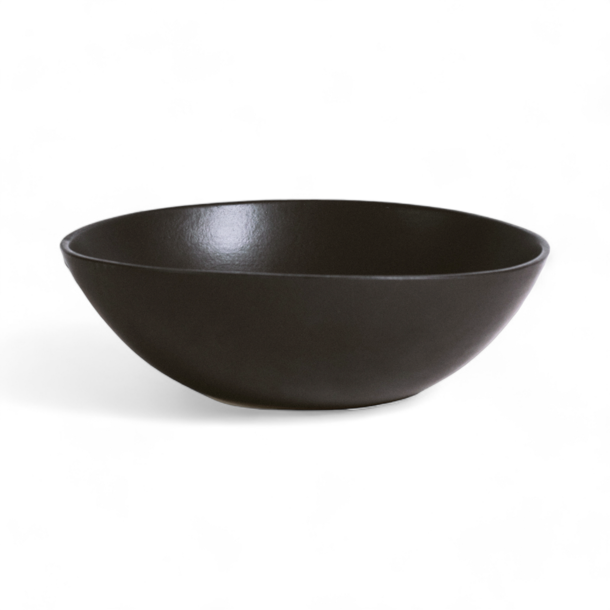 Empty white stoneware serving bowl with a matte finish, displayed against a white background.