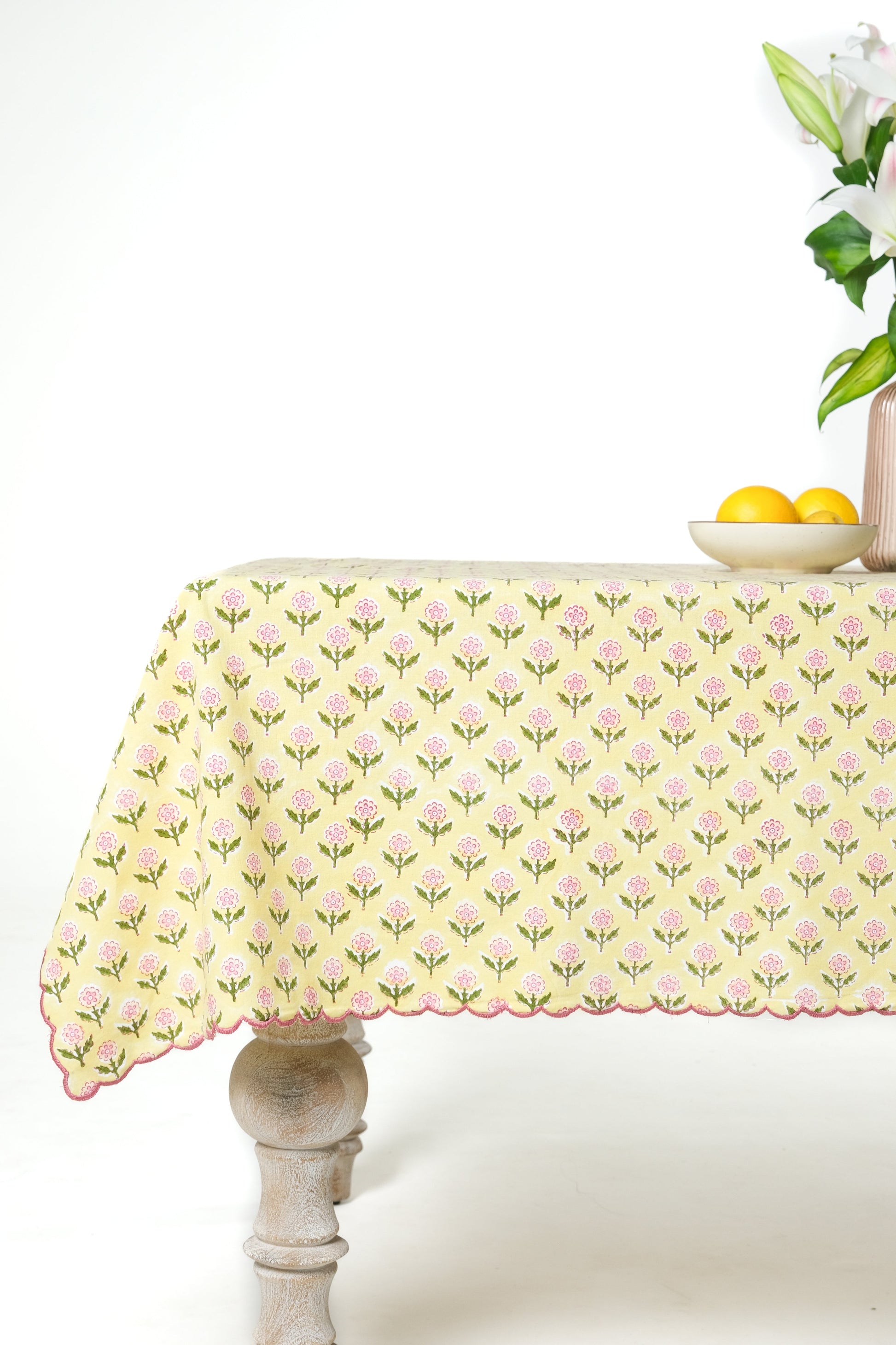 Mona scallop embroidered blockprint butter yellow tablecloth on dining table