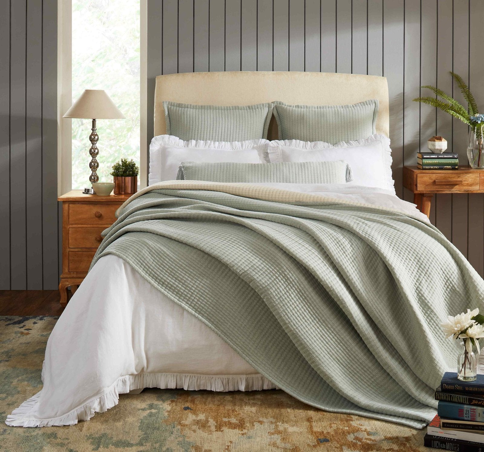 BT-106-9496_4|Sage green textured reversible quilt blanket elegantly draped over a bed with white sheets, enhancing a serene bedroom decor.