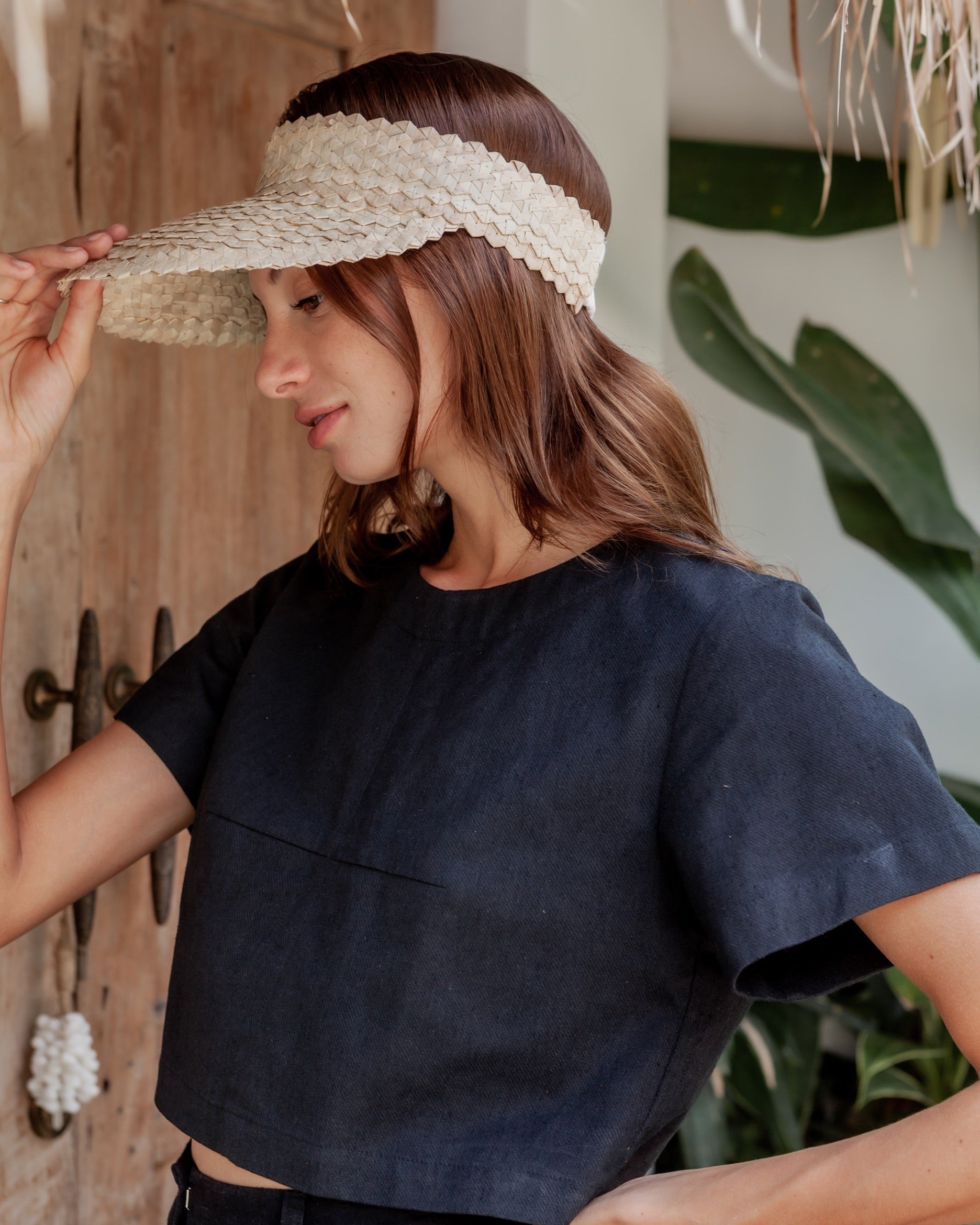 Rattan Sun Visor in Blonde handmade by Village Thrive using natural materials.