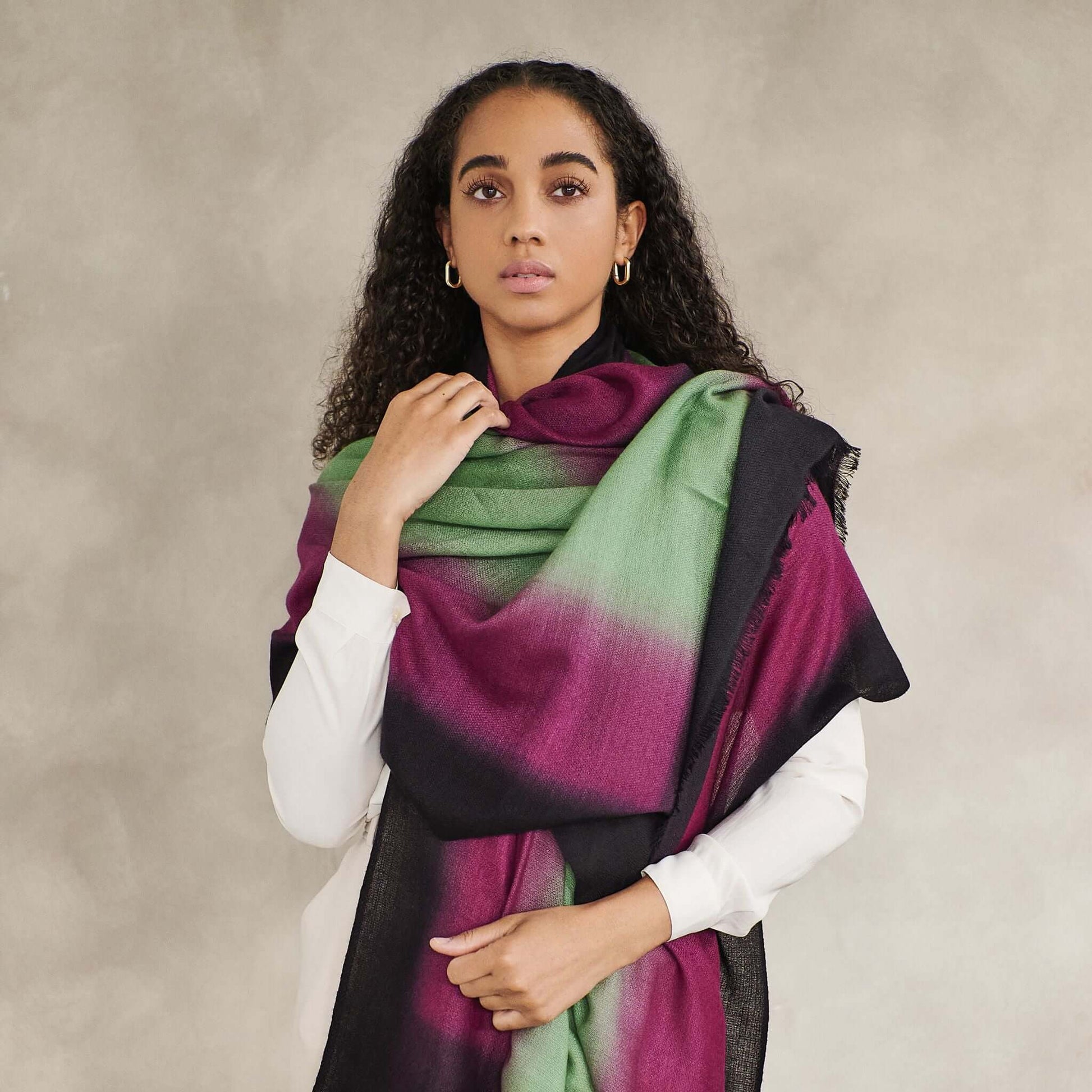 Iris Courtyard Green Purple Hand Woven Cashmere Merino Scarf worn by a model, showcasing the unique hand-dyed colors.