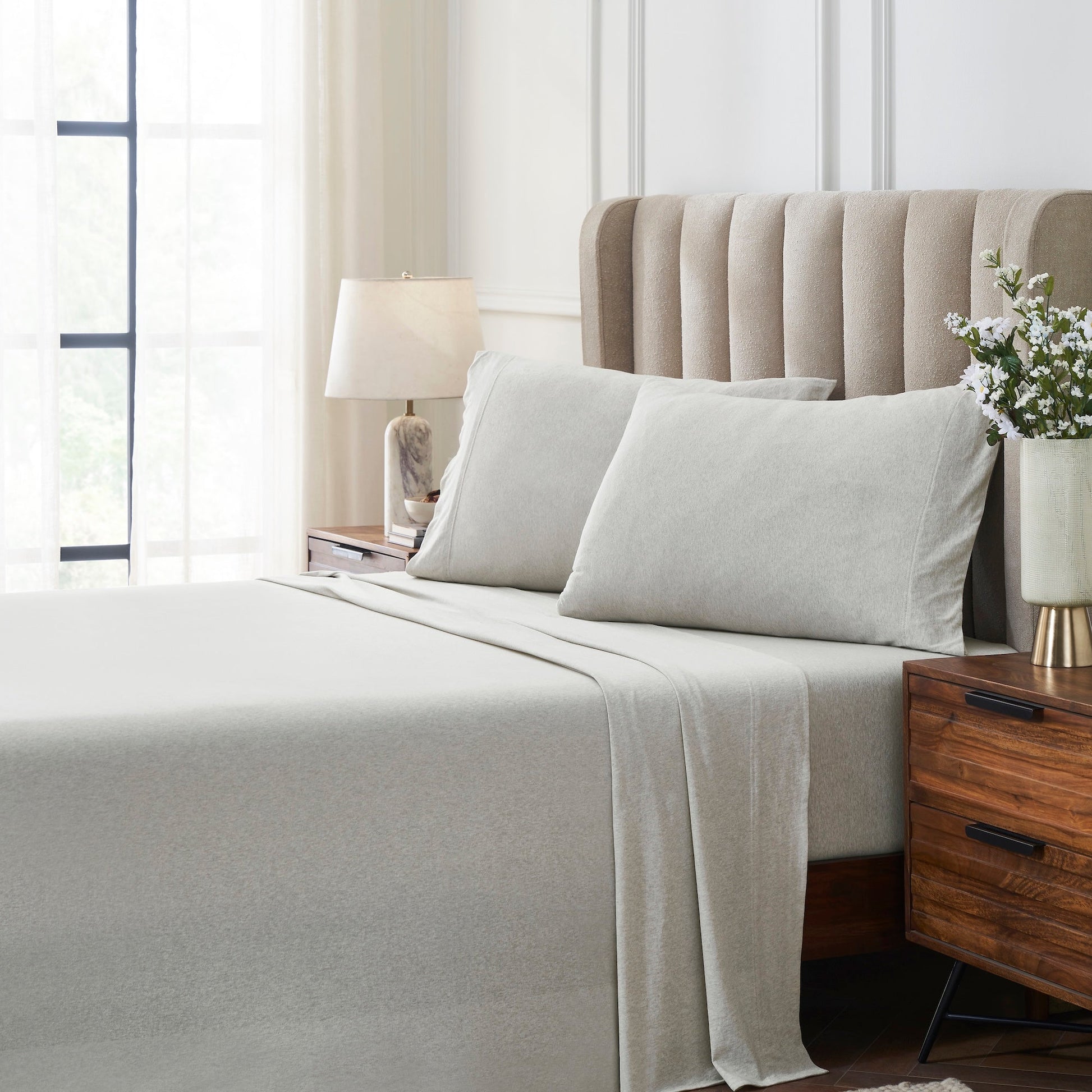 QSS-526-6080_3|Elegant light grey 100% cotton jersey sheets on a bed, offering luxurious softness and breathable comfort for a modern bedroom.