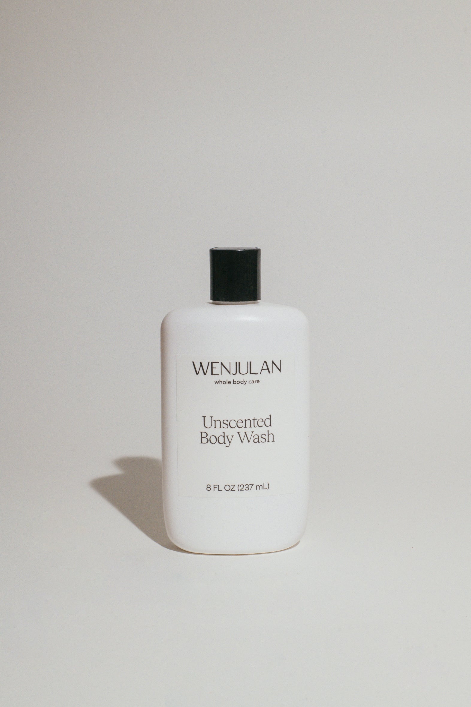 Wenjulan Whole Body Care Unscented Body Wash liquid soap bottle front on a light gray background

