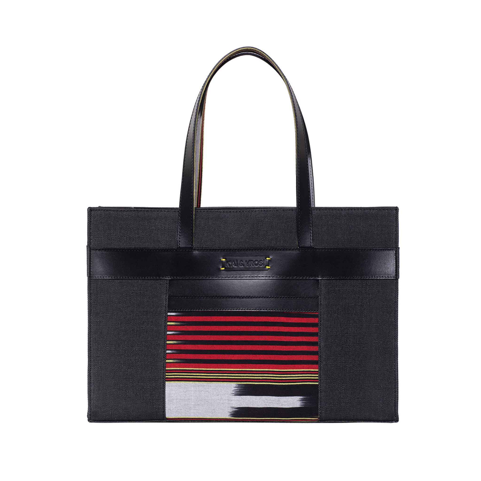 Zua black tote bag. Leather detailings on the body, leather hand strap, canvas on the body and handwoven fabric pocket in the front