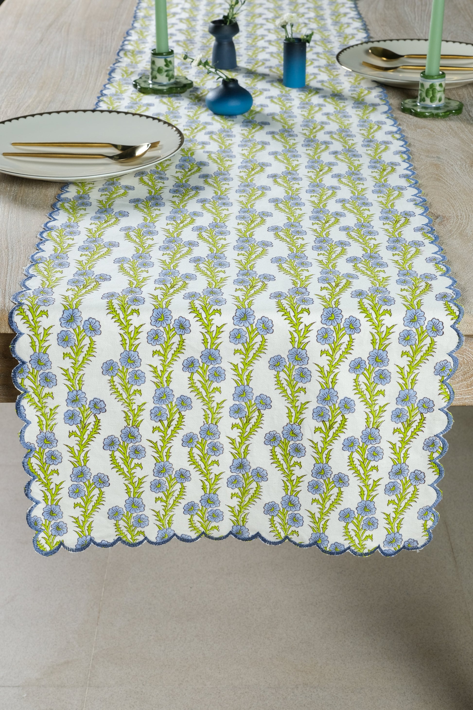 Inner Child blue forget-me-not scallop embroidered blockprint tablerunner on wooden table