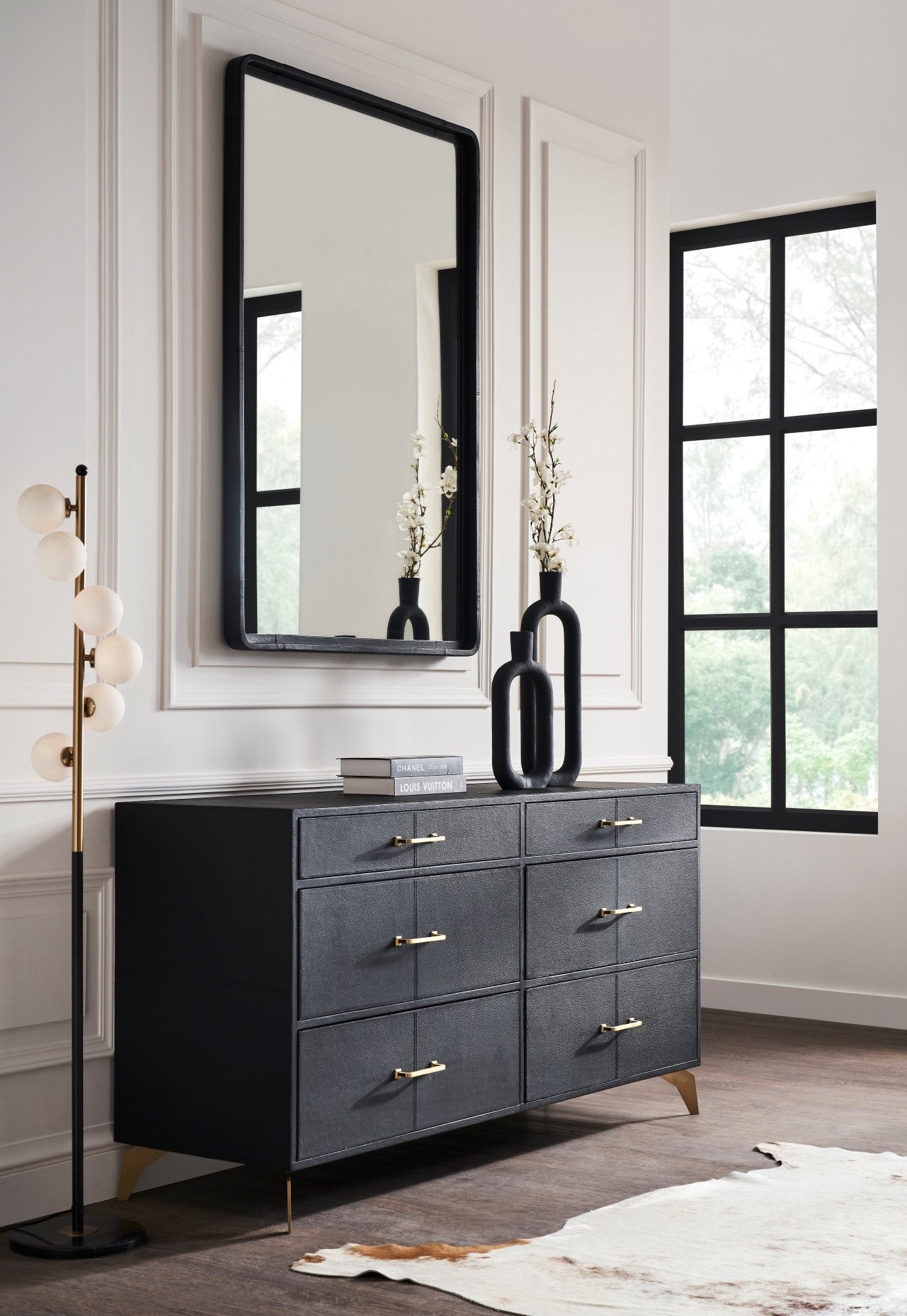 FN-5200-642033_1|Elegant black leather six-drawer dresser with golden handles and tapered legs, offering sophisticated bedroom storage solutions.