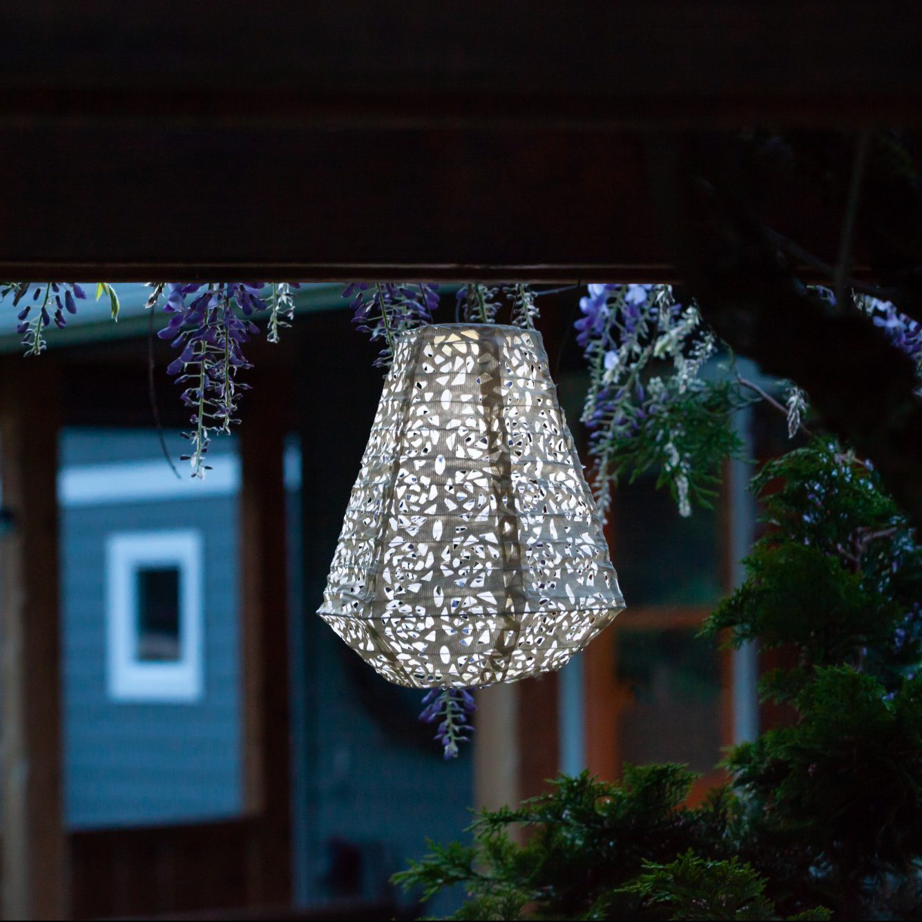 Soji Stella Prism Tyvek Solar Lantern glowing at night
