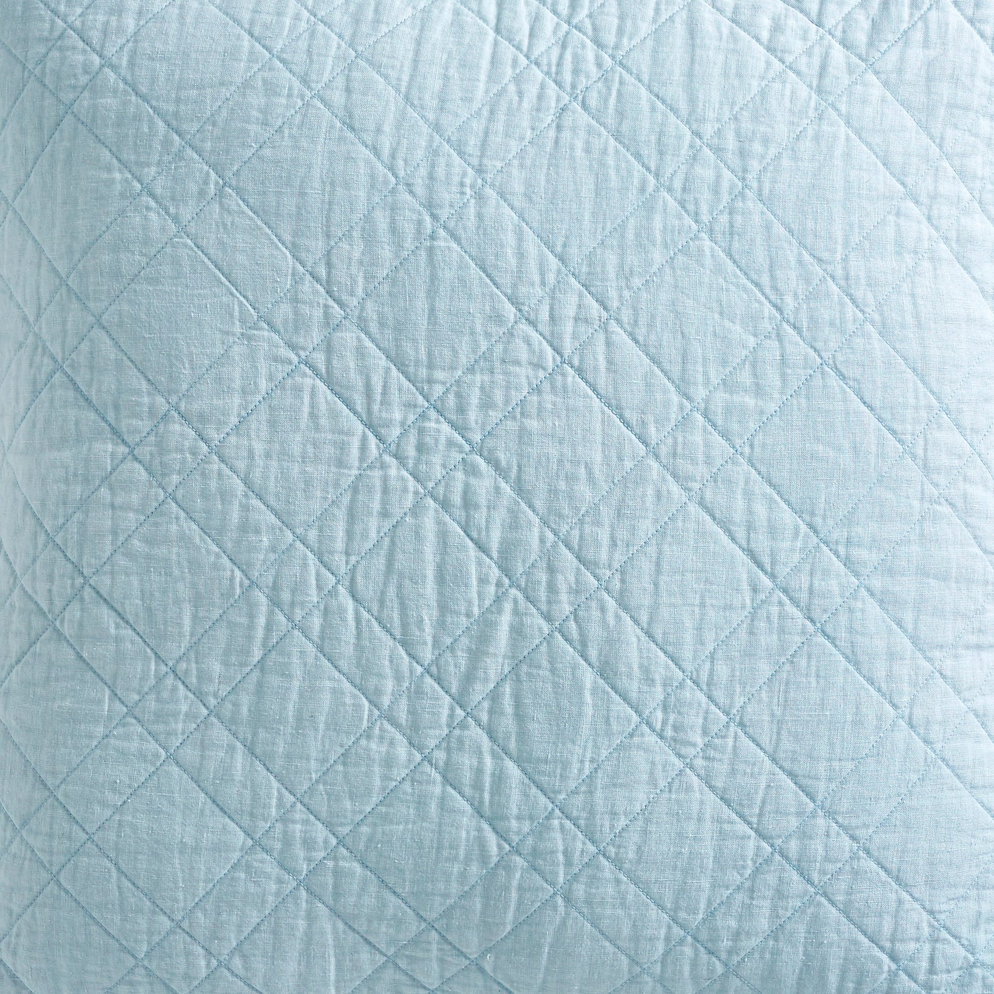CL-255-9496_7|Close-up of a serene light blue quilted coverlet, highlighting its crisp diamond stitching and inviting soft texture.