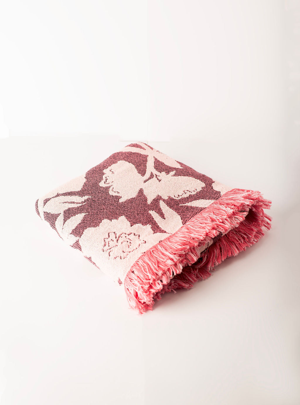 Folded Addy Mulberry pink floral reversible jacquard woven throw blanket