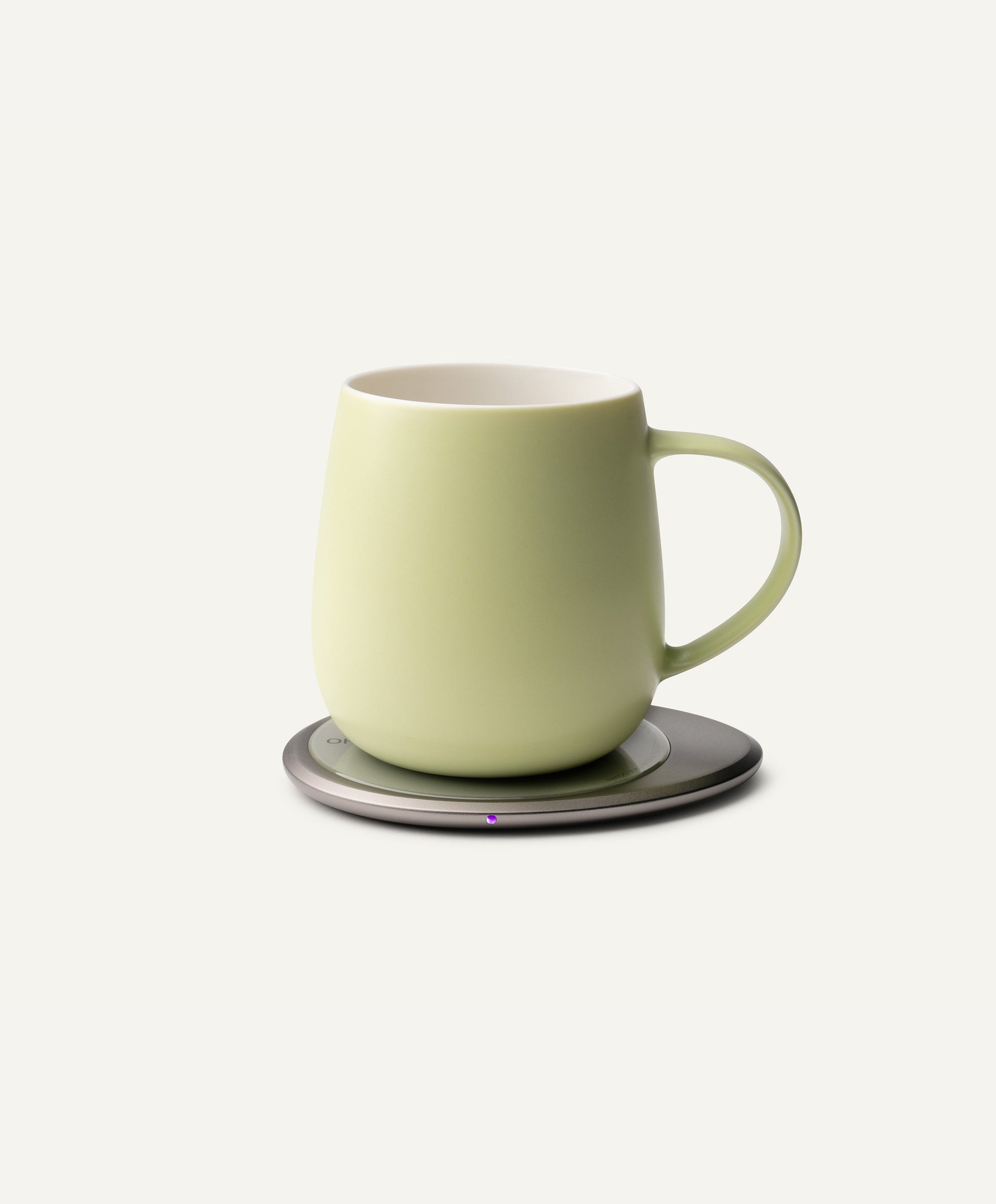 Ui 3 Self-Heating Ceramic Mug 12 fl oz / 355 mL in Verde Green on Ohom Charging Pad 3