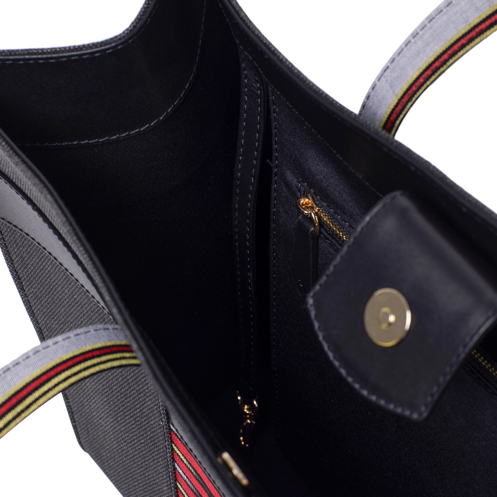 Made of canvas, leather and fabric. the appearance of the back of Zua tote bag