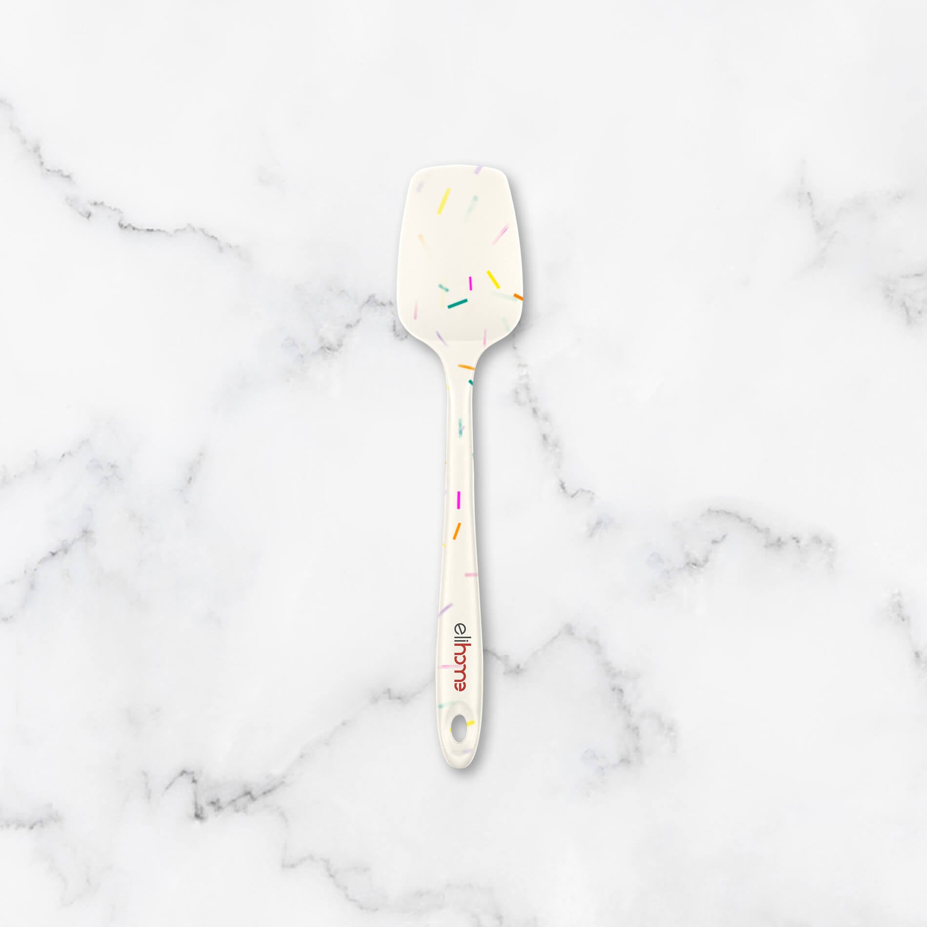 Elihome Classic Spoonula featuring a white design with a colorful sprinkles (confetti) pattern. Fun, heat-resistant silicone spoon spatula perfect for baking birthday cakes and mixing batter.
