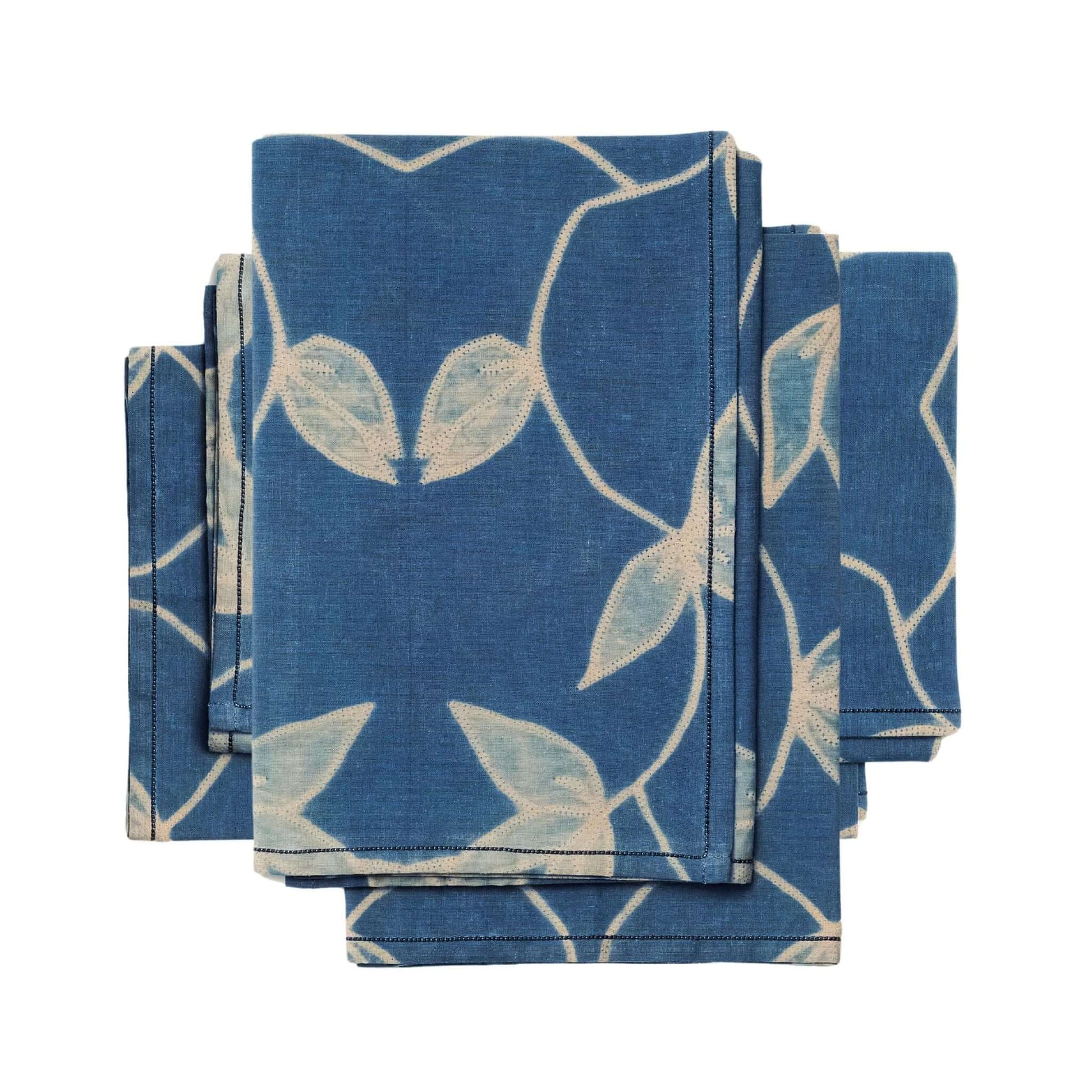 Folio Indigo Handcrafted Shibori Cotton Table Napkins ( set of 4 ) in blue with floral patterns, perfect for elegant dining.
