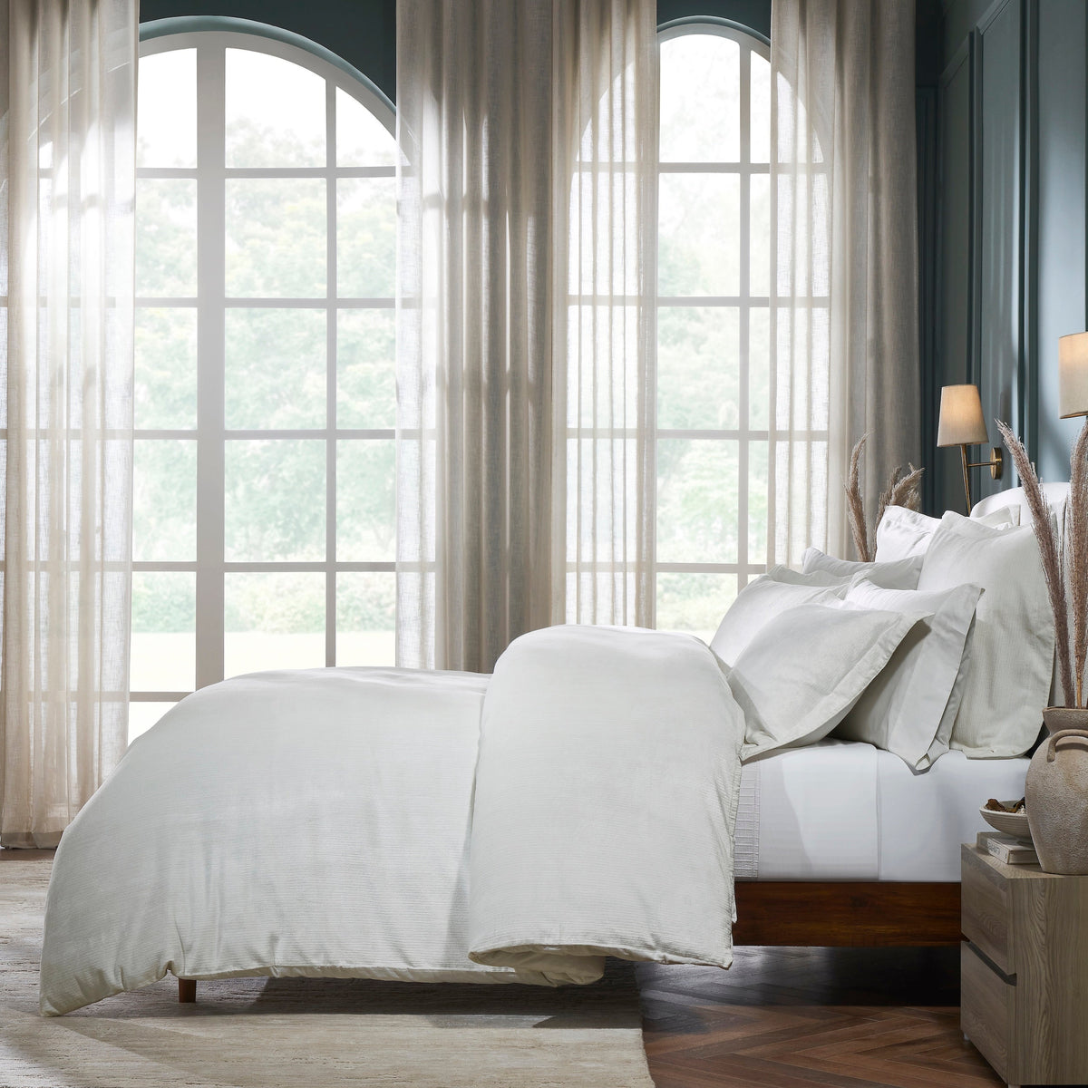 DT-052-10692_4|Soft off-white textured duvet cover and matching pillows for luxurious comfort. Overhead view of a cozy, inviting bedroom setup.
