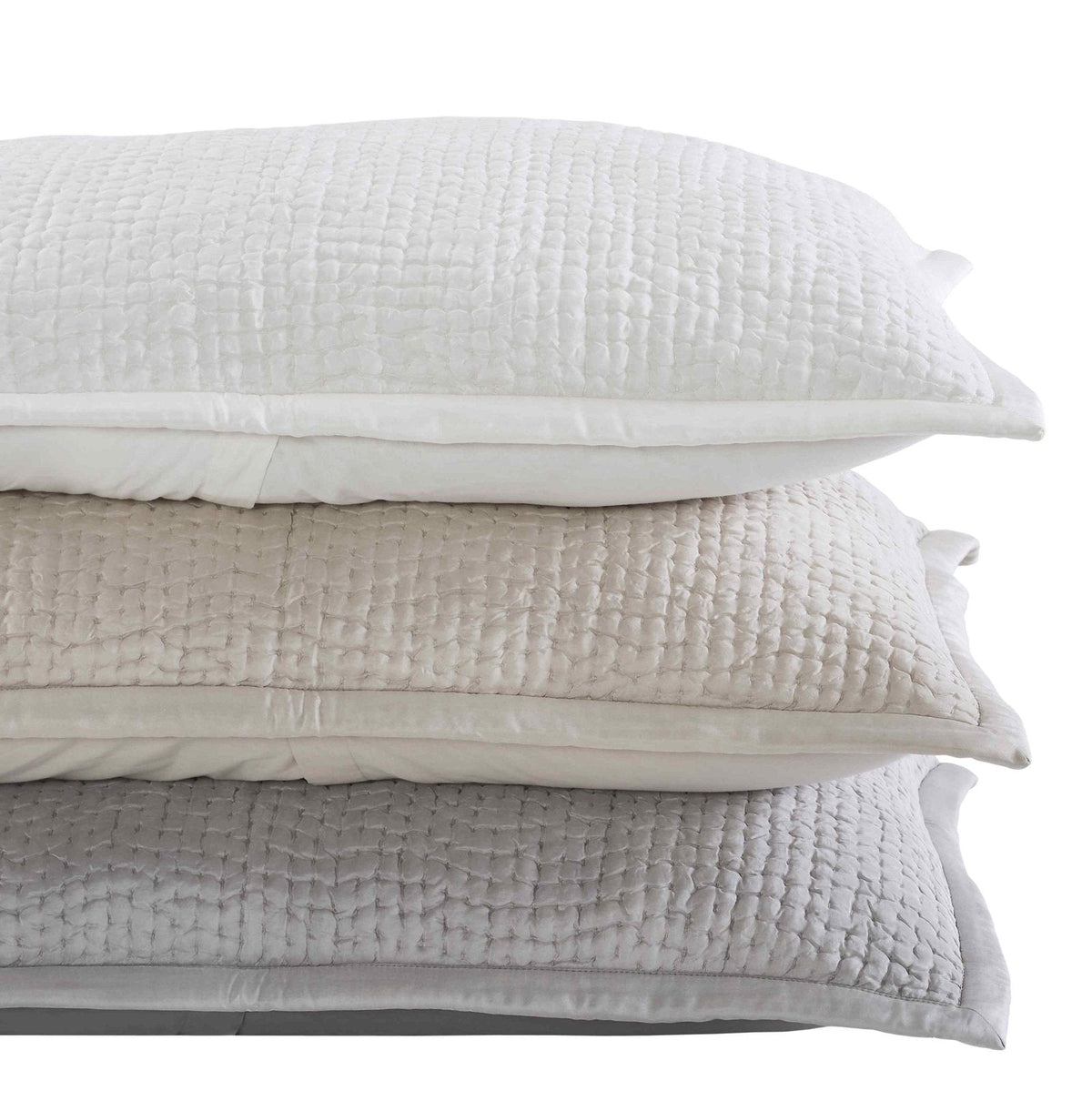 ES-156-2626_2|Stacked quilted coverlets in light grey, beige, and white. Features a uniform, small grid pattern with vertical stitching. Soft woven texture.