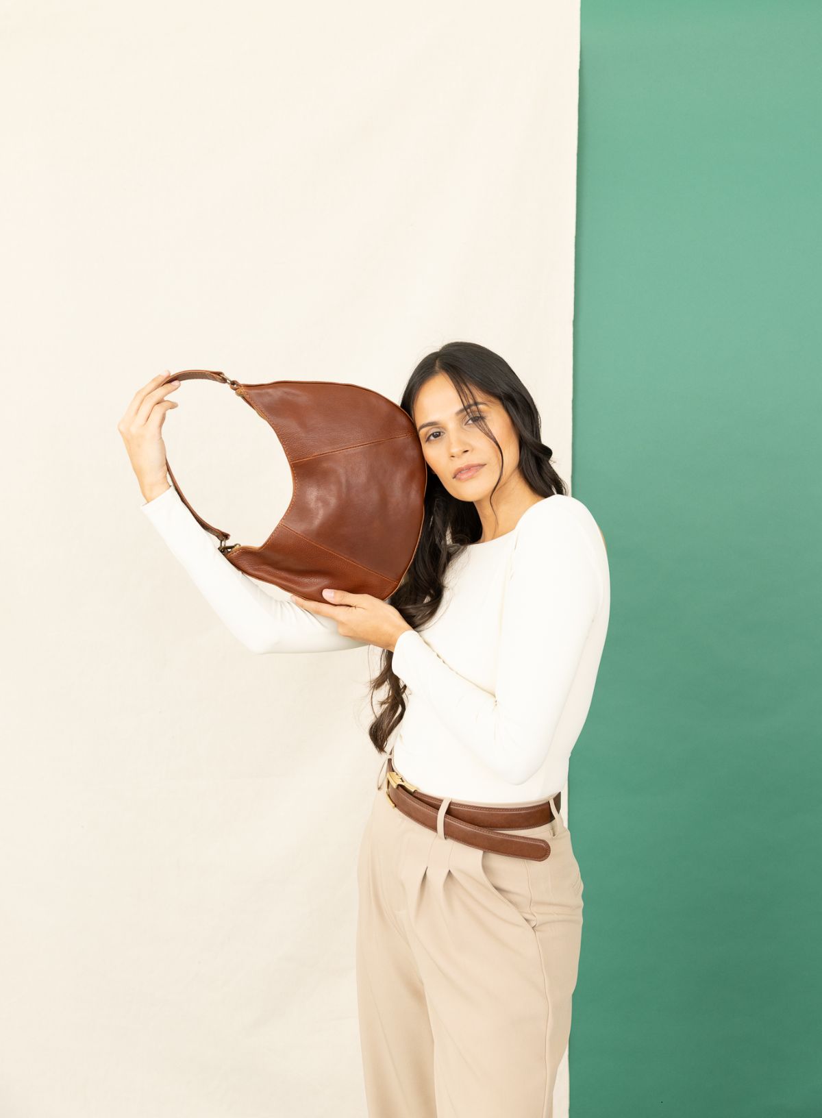 saddle shoulder bag from womens bags in brown showcasing side view.