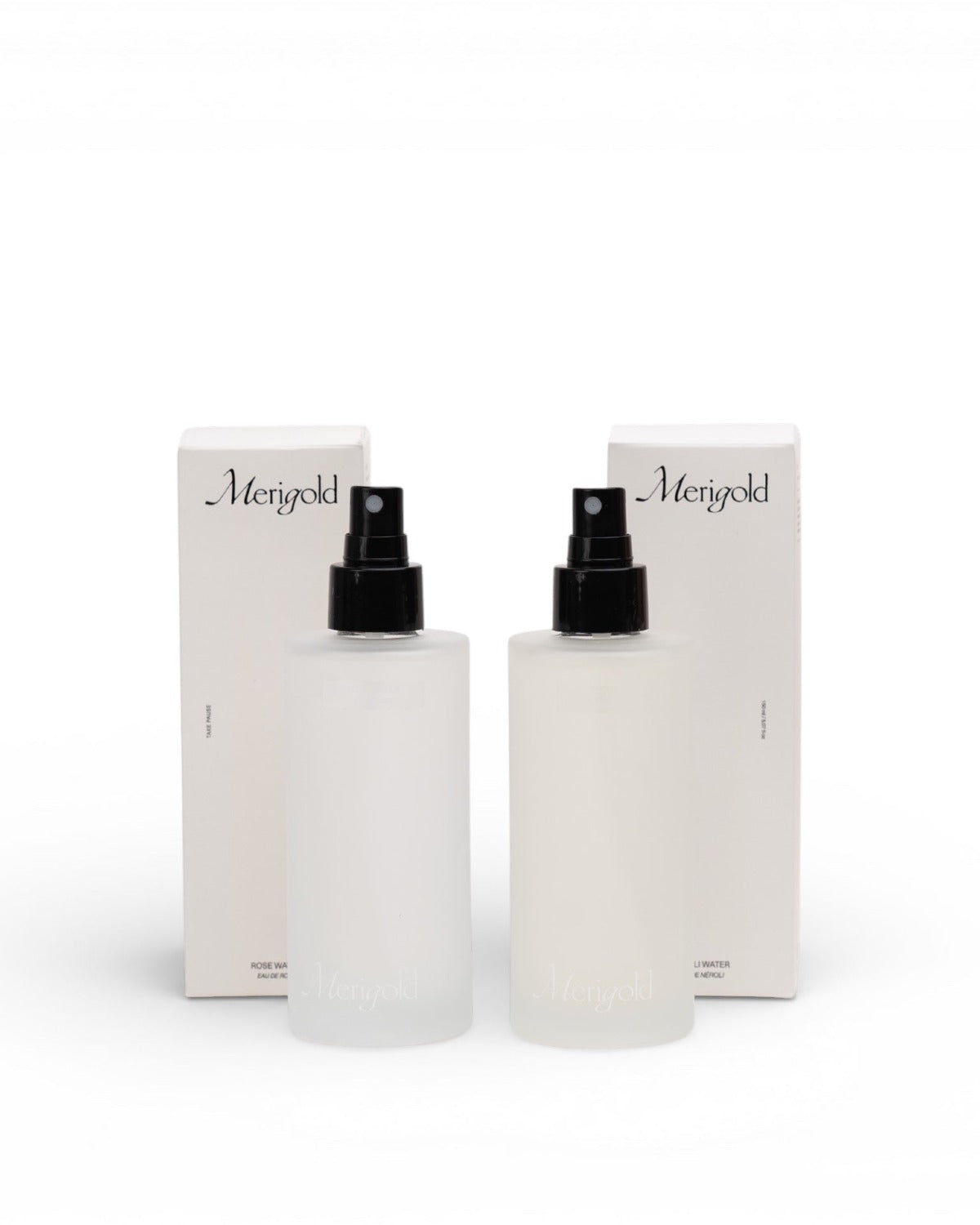 Two skincare bottles with black caps and Merigold branding on a white background