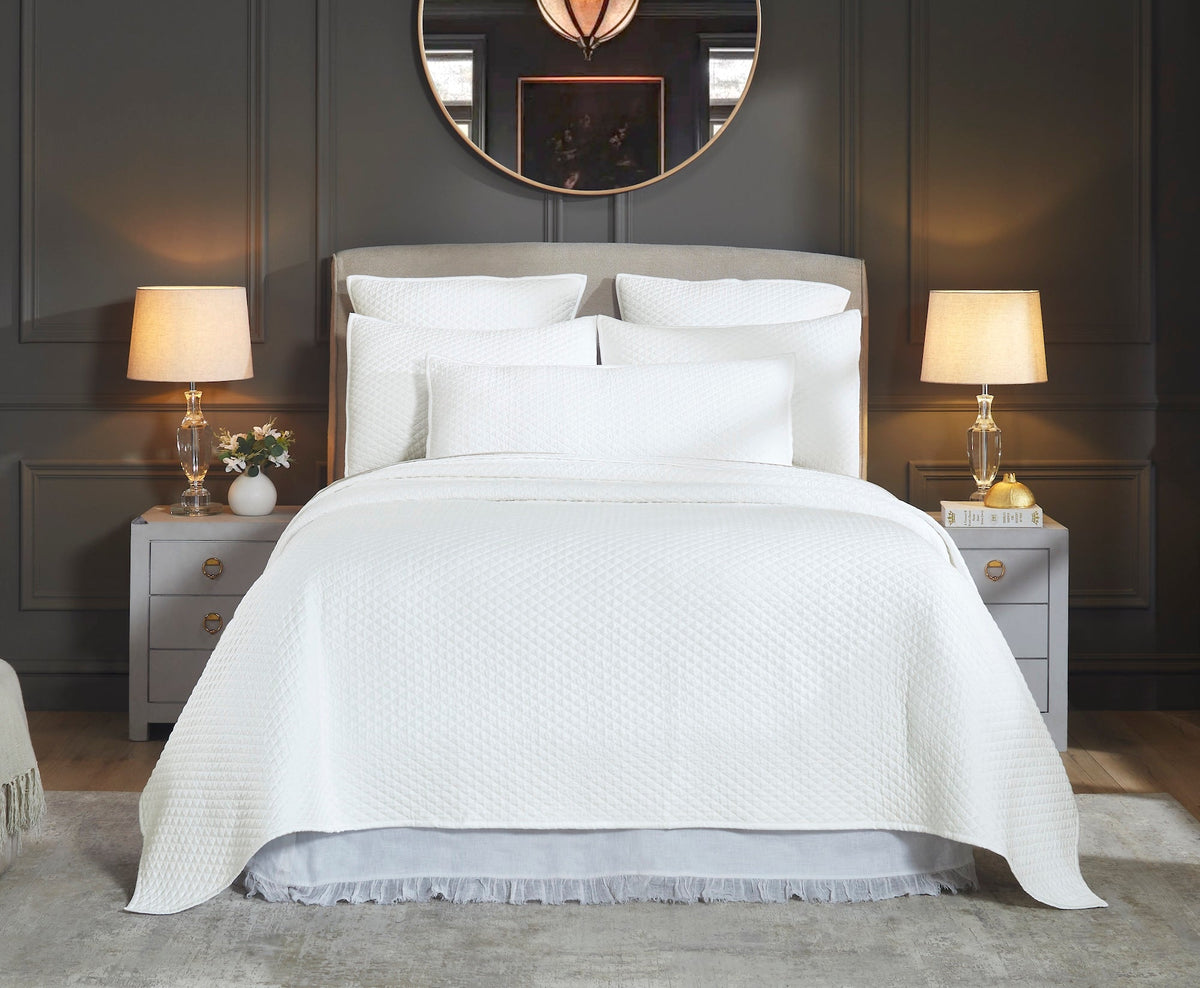 CL-264-X_2|Stack of three soft white textured quilts, offering cozy bedspreads and comfortable bedding essentials for any home.