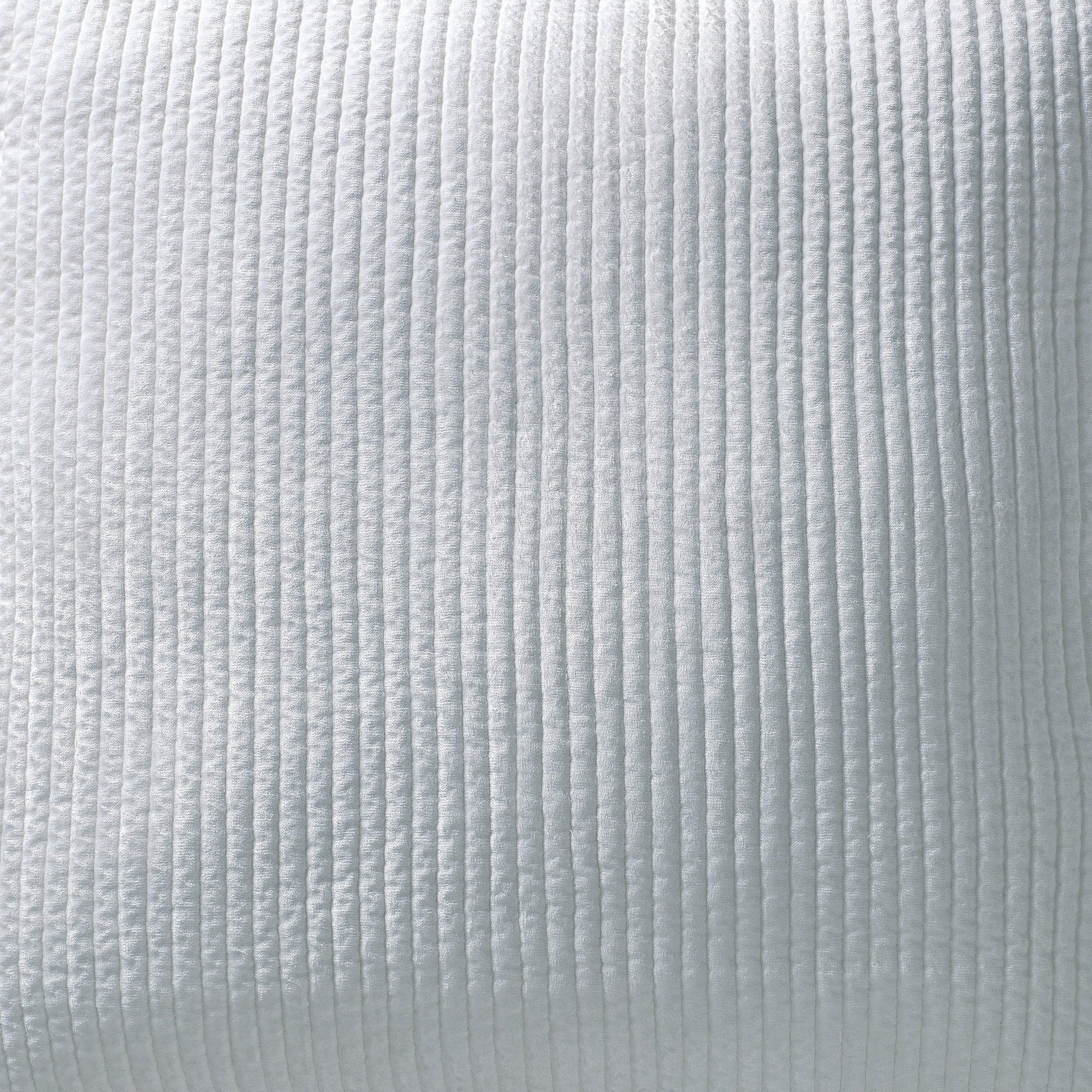 SS-157-2026-PO1285_2|Close-up of crisp white velvet coverlet, highlighting its soft textured feel and refined vertical channel quilting pattern for elegance.