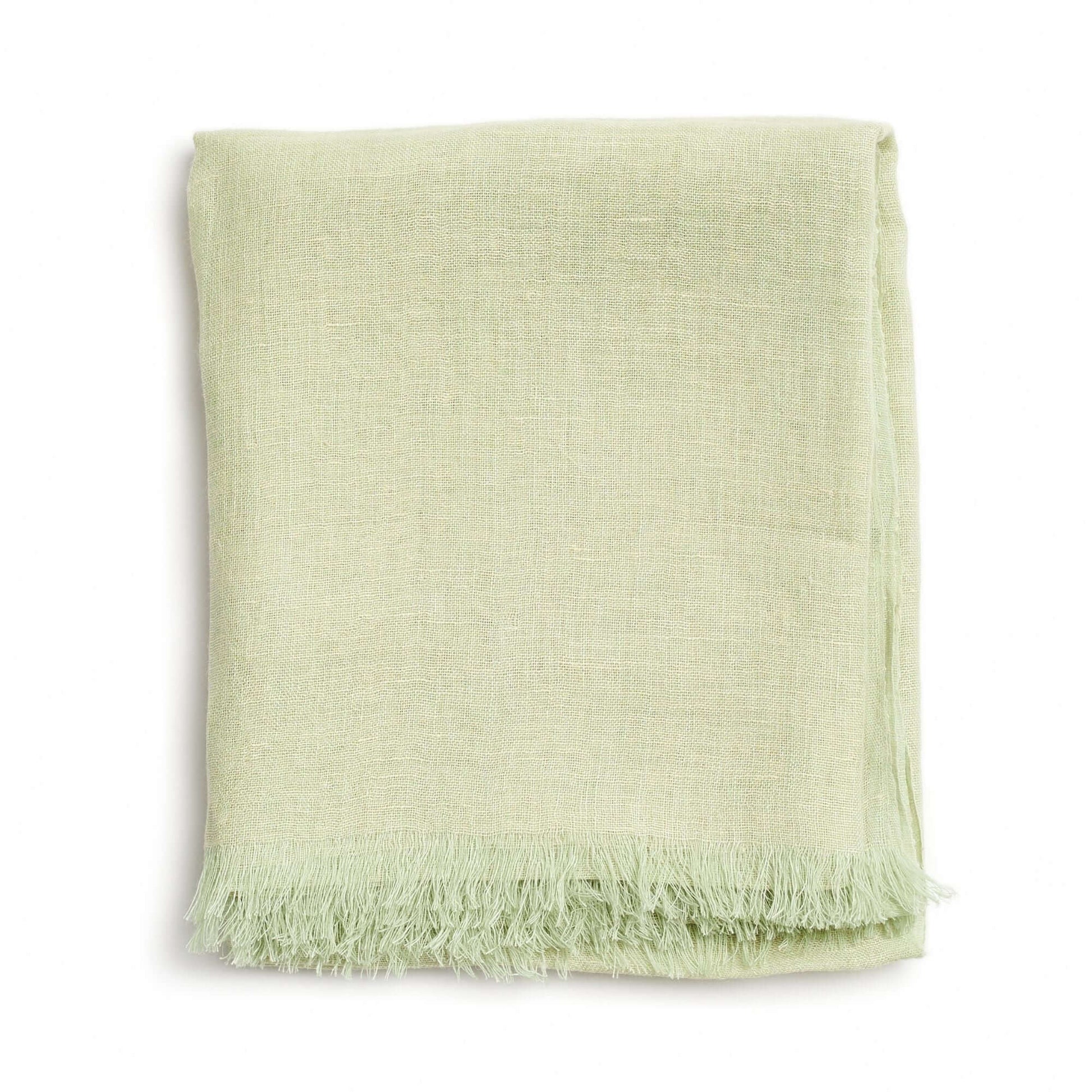 Soya Pastel Lime Green Hand Woven Soft Linen Scarf elegantly folded showcasing its soft texture and lime green color.