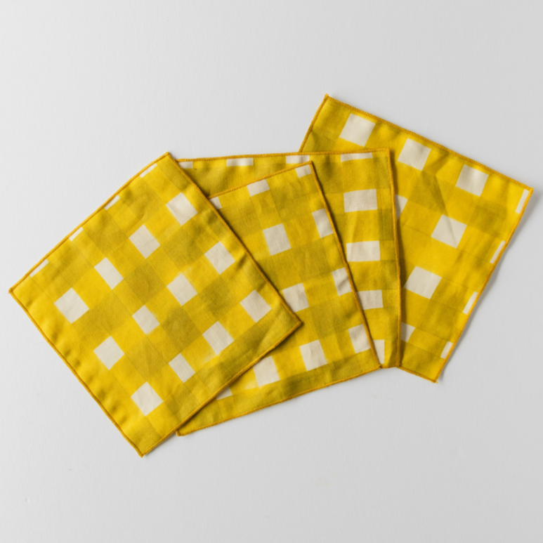 Yellow Cross-Hatch linen cocktail napkins styled at cocktail party setting - Goldie Home