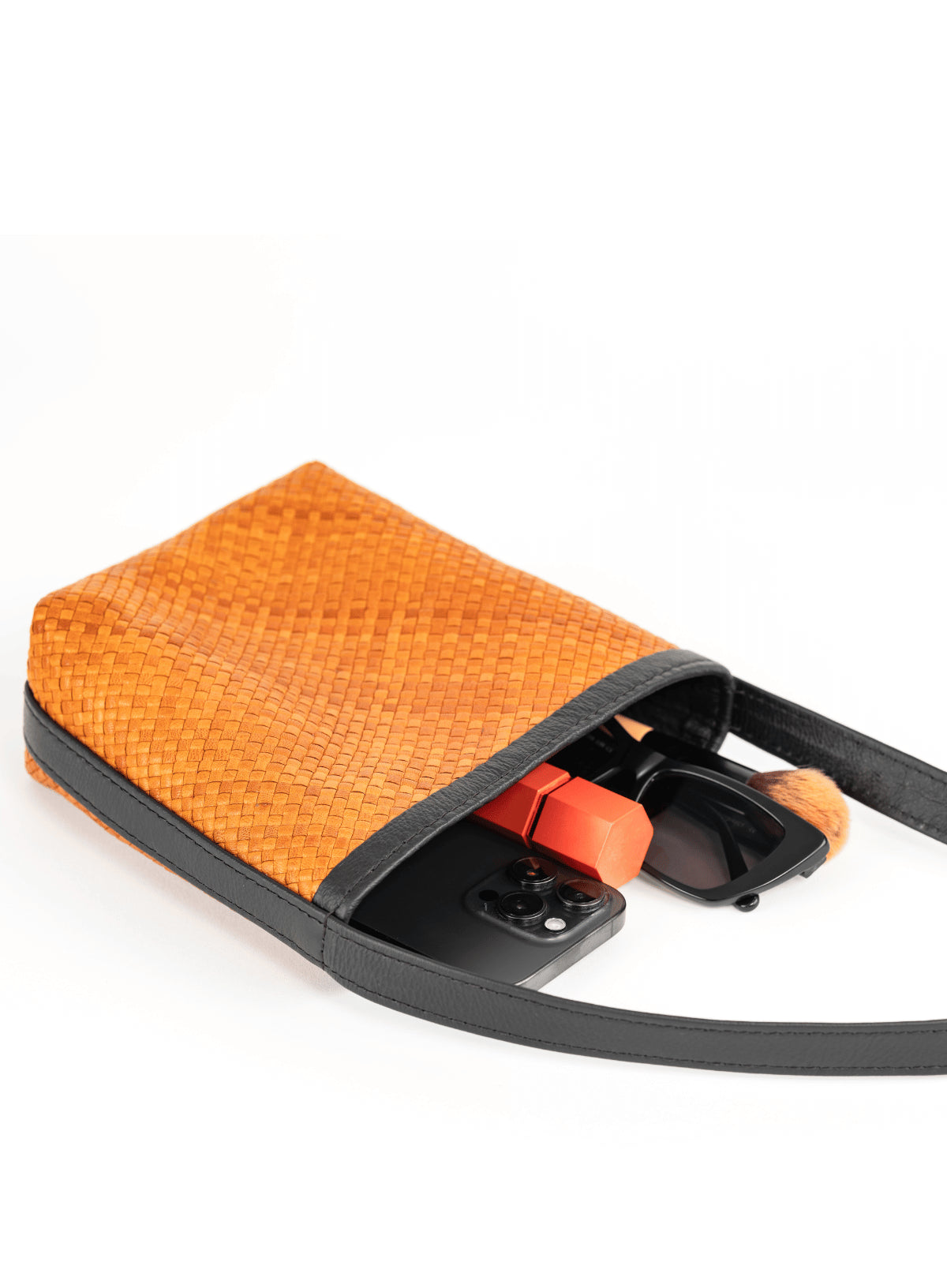 panye crossbody bag from our spring collection - interior view with accessories.