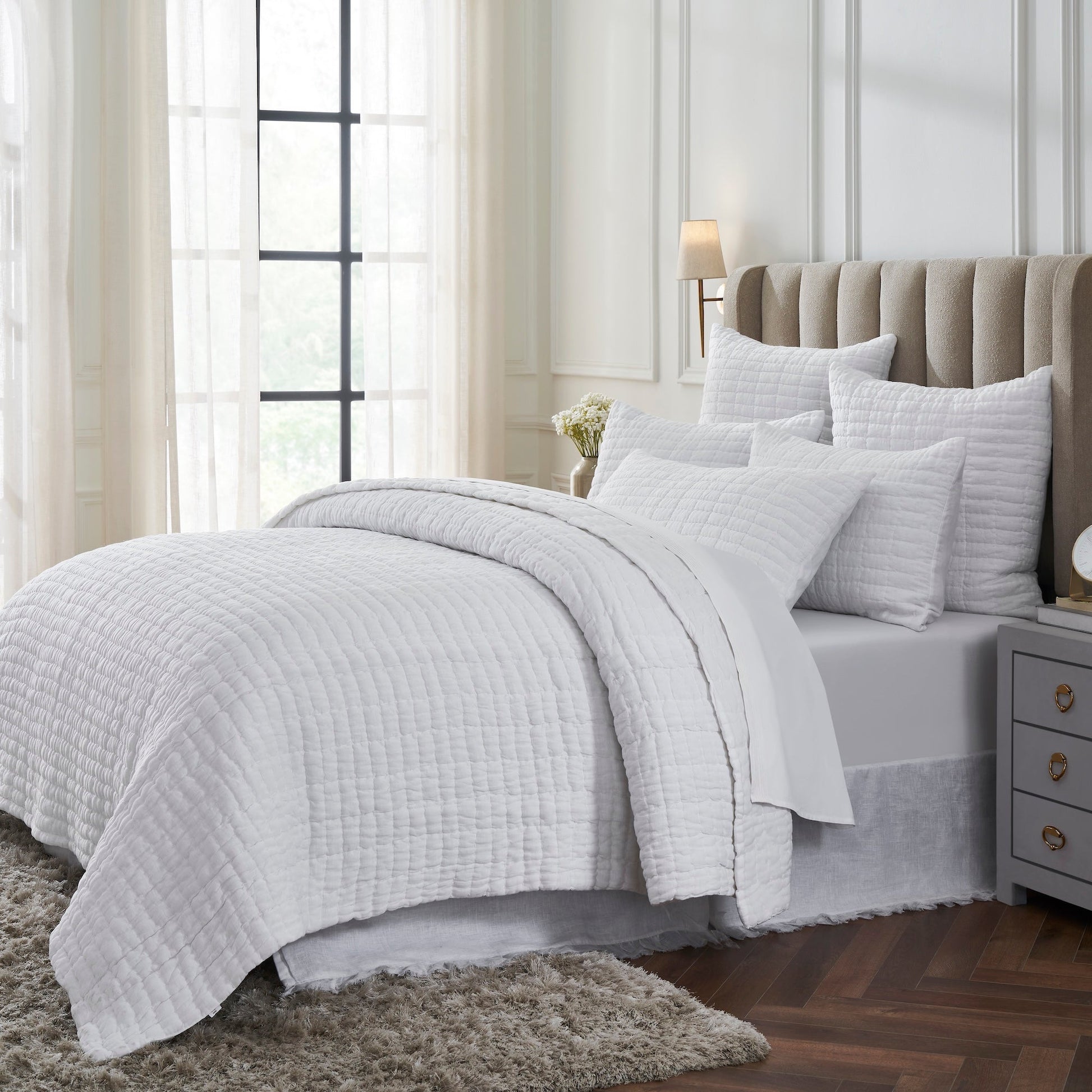 QT-372-11096_2|Cozy white textured quilt set enhancing a bright bedroom, providing soft comfort and an elegant, serene bedding ensemble.