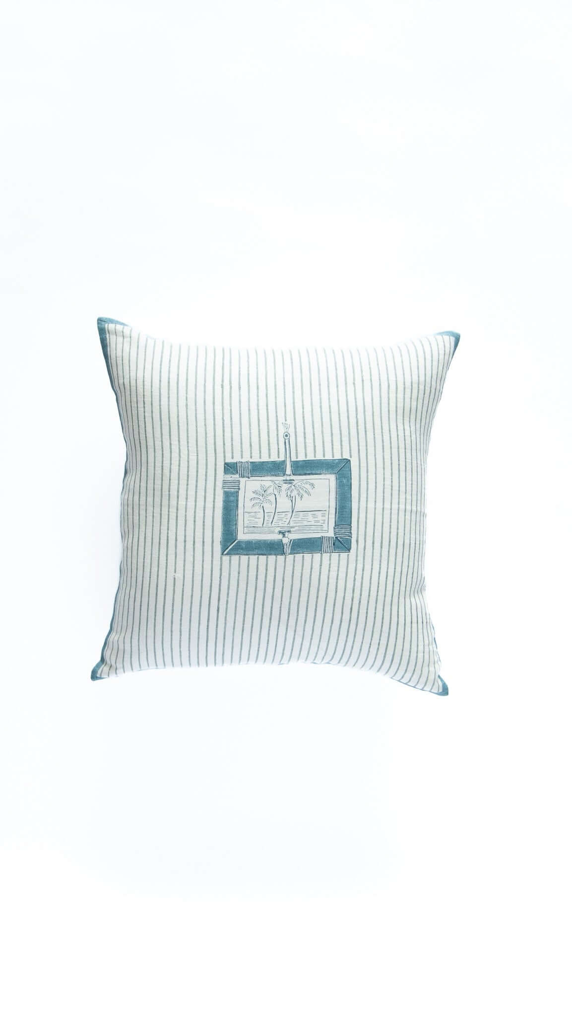 Decorative pillow with a small flag design on a white background