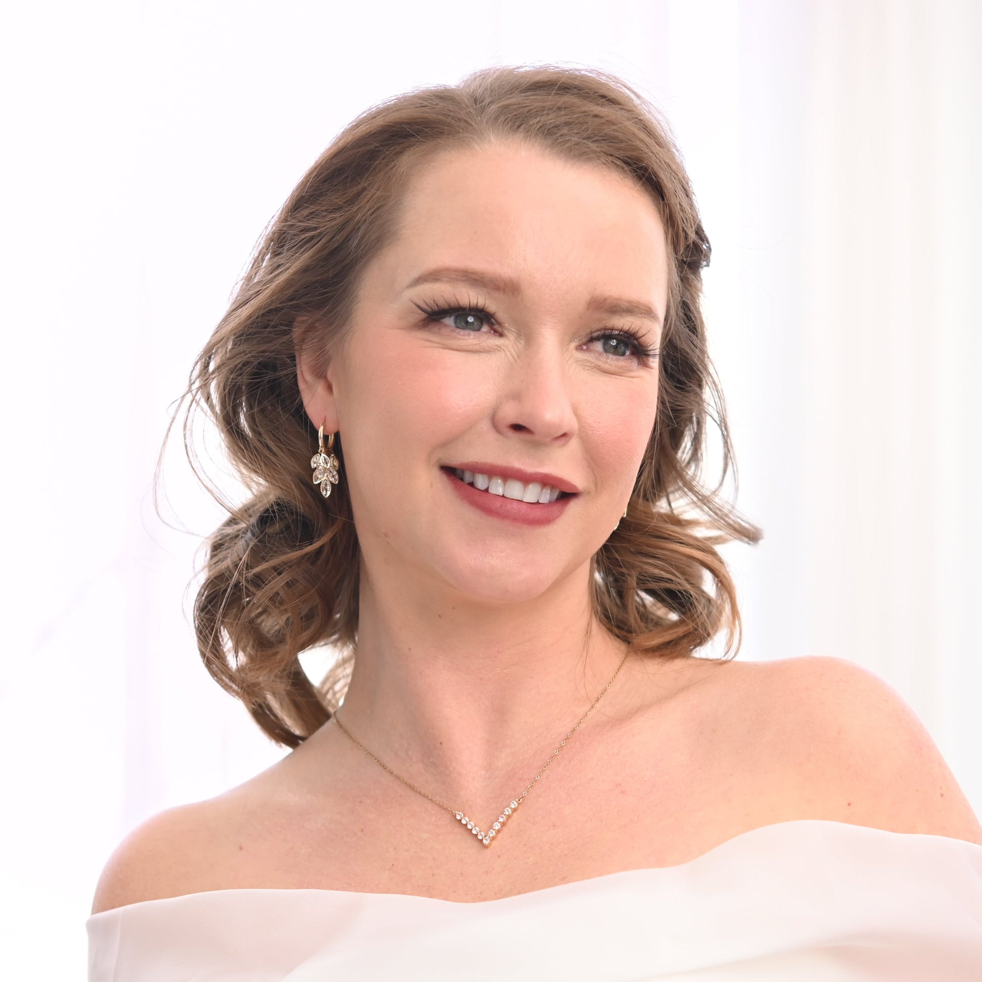 A photo of a woman wearing beautiful wedding jewelry set, gold and fashion jewelry, special christmas presents
