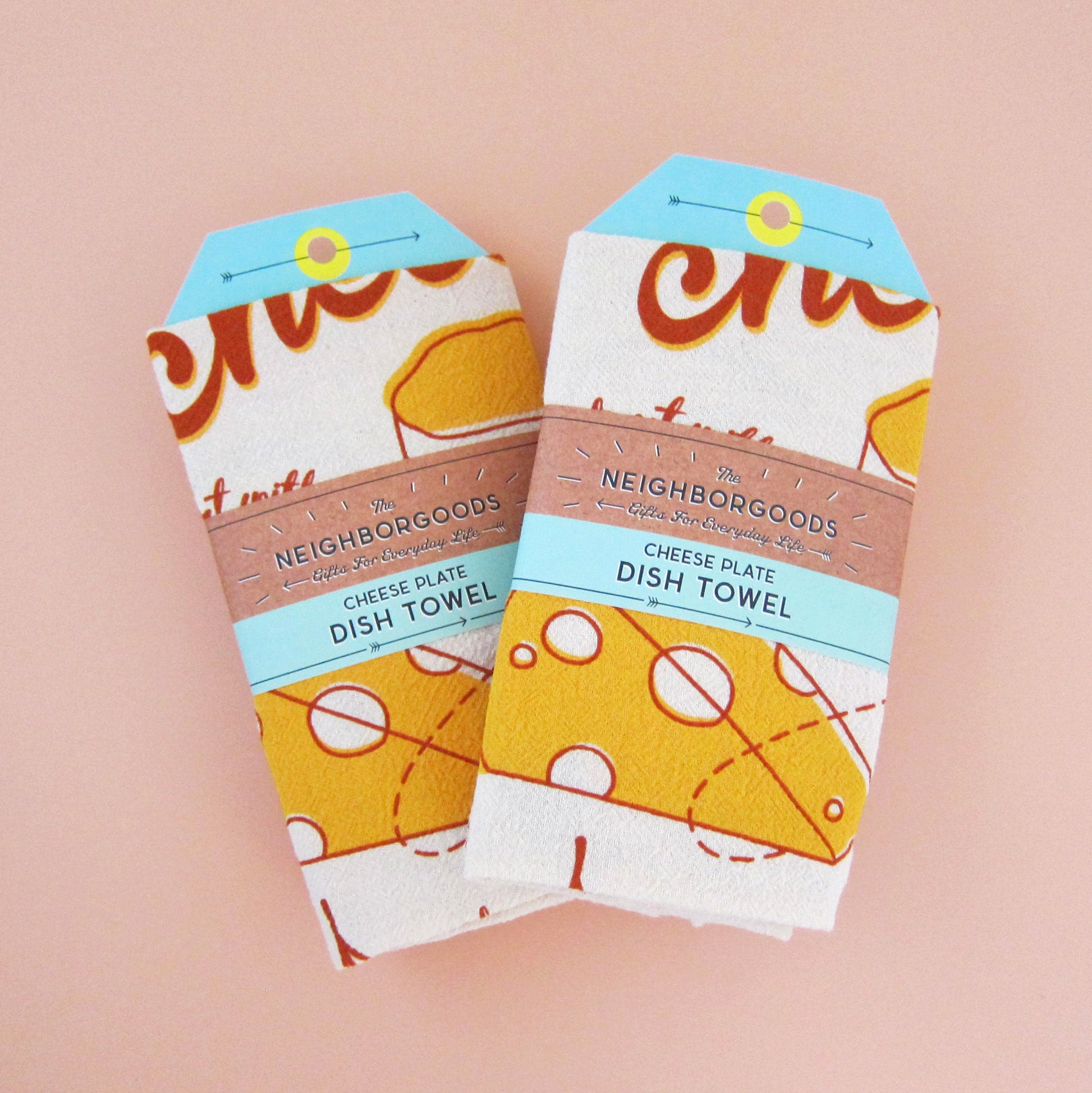 Two cheese dish towels individually packaged in branded belly band sleeves