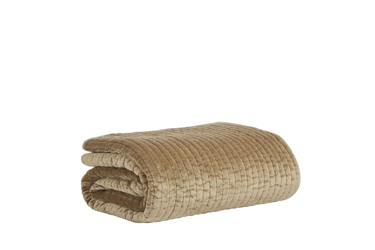 QT-362-11096_7|Folded camel velvet quilt with a luxurious textured striped pattern, ideal for a warm and elegant bedding accent.