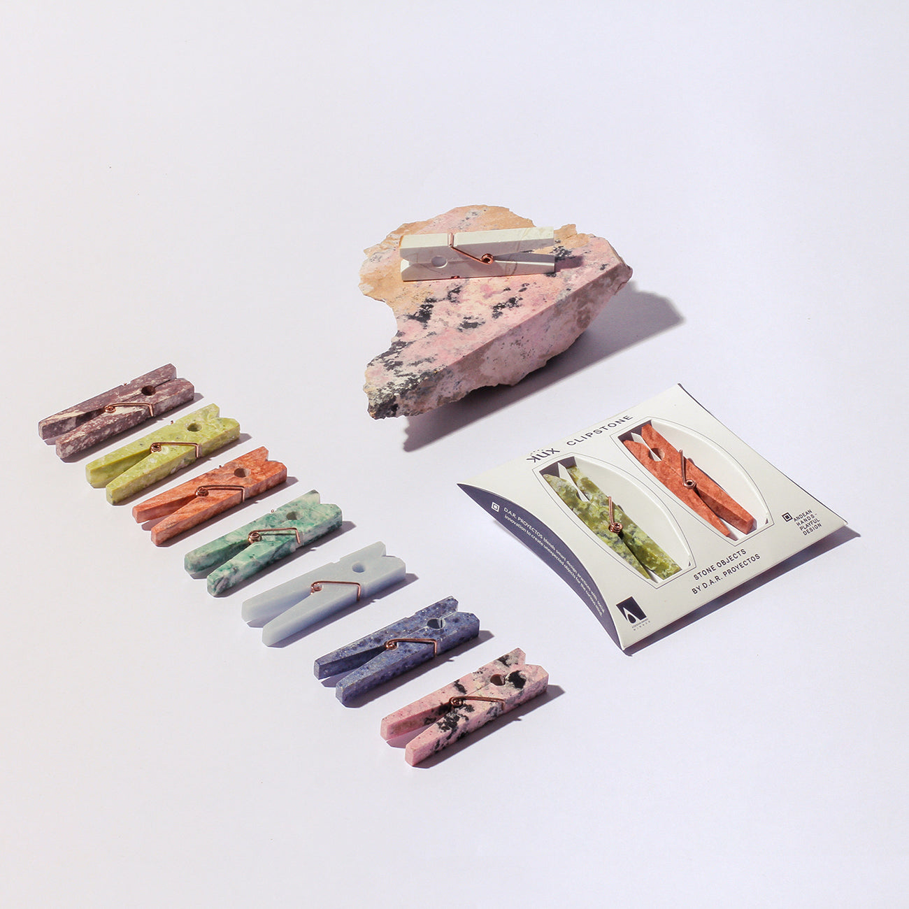 Curated selection of decorative gemstone clips serving as elegant and functional slow design home accessories.
