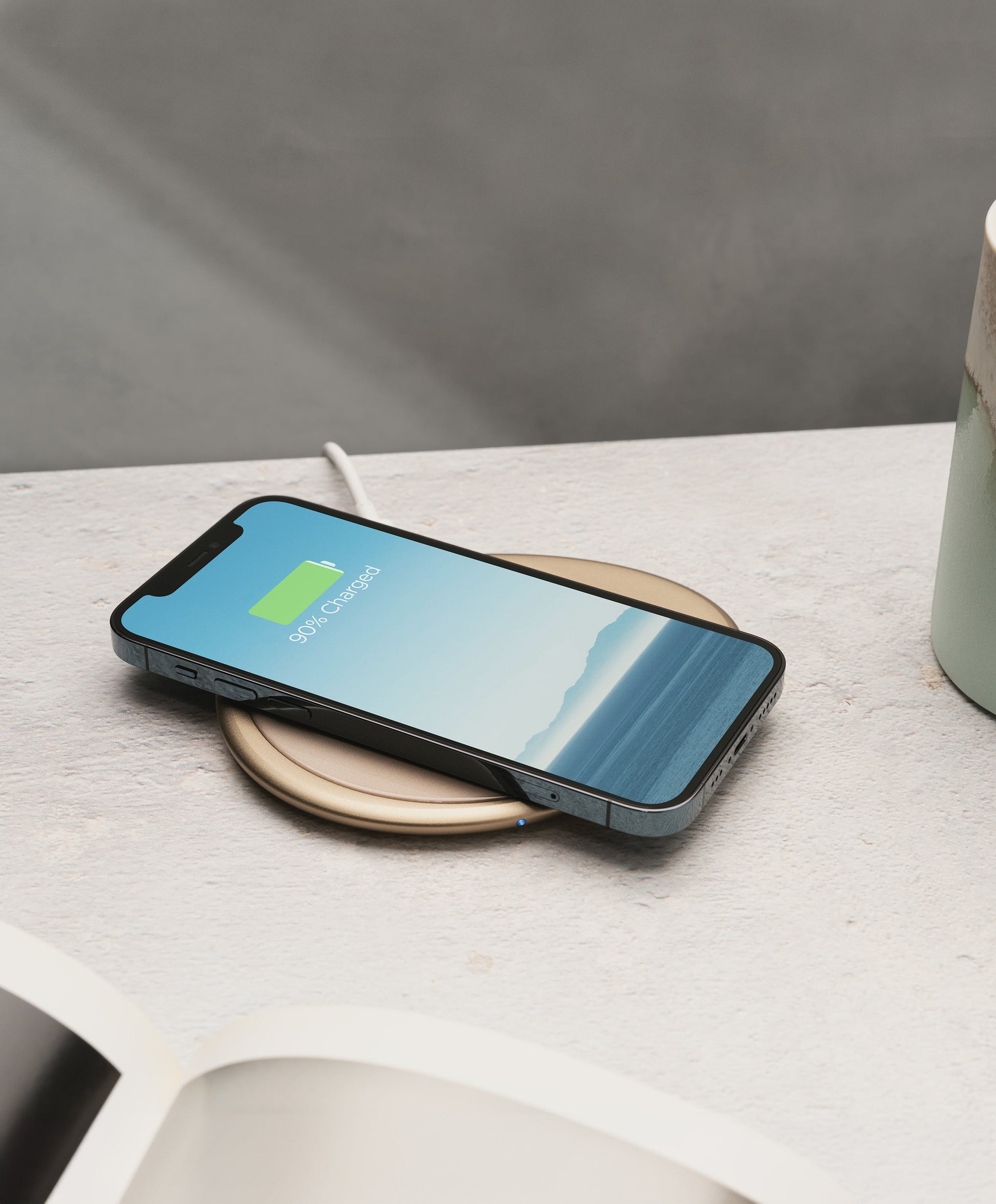 Ui Artist Collection Gold OHOM Pad 3 wirelessly charging iPhone