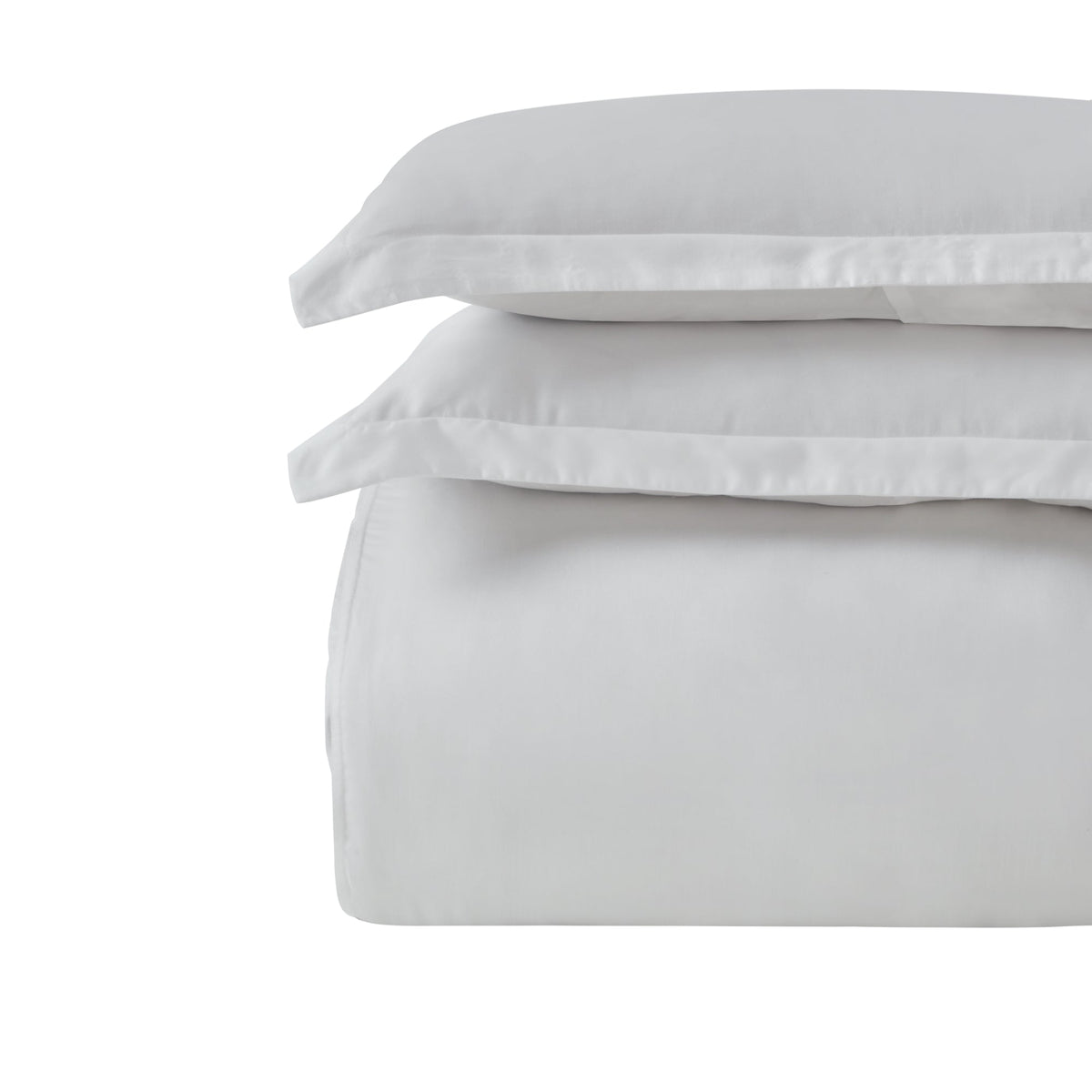 DT-047-9092_6|Stack of fresh white duvet cover and pillowcases, highlighting their soft texture and timeless appeal for any bed.