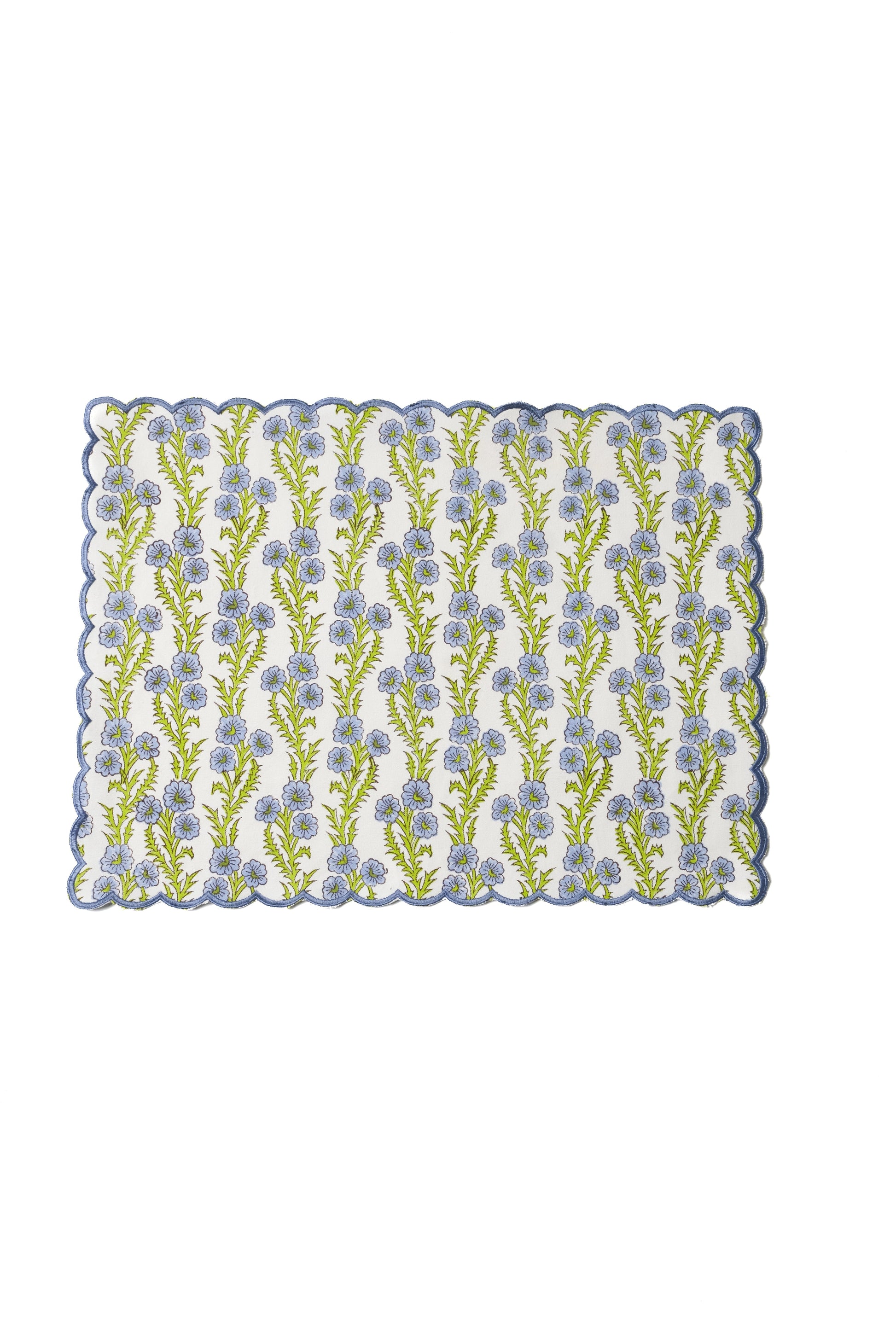 Forget-me-not scallop embroidered placemat with blue flowers and green stems on white fabric from Inner Child