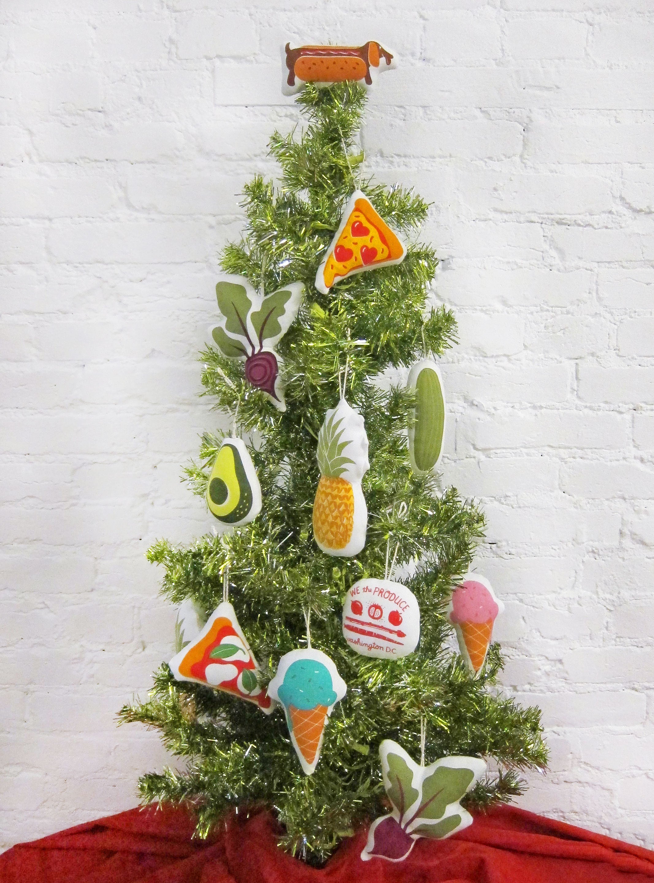 DC flag ornament pictured on a small tree with an array of other Neighborgoods ornaments