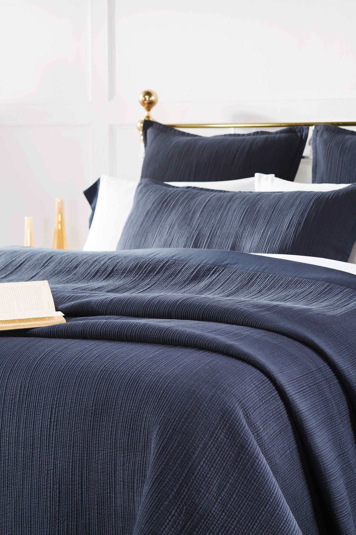 CL-167-9496_3|Close-up of navy blue textured coverlet with subtle stripe pattern, soft, luxurious bedding for modern rooms.