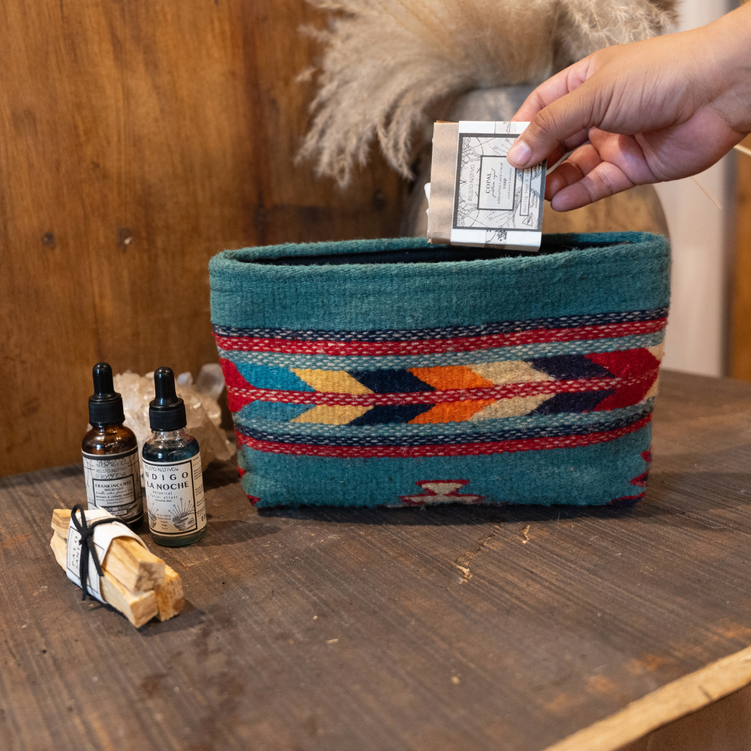 Handwoven pouch with abstract Zapotec arrow design in bold colors featuring internal pocket; perfect for makeup, wallet, or daily essentials.