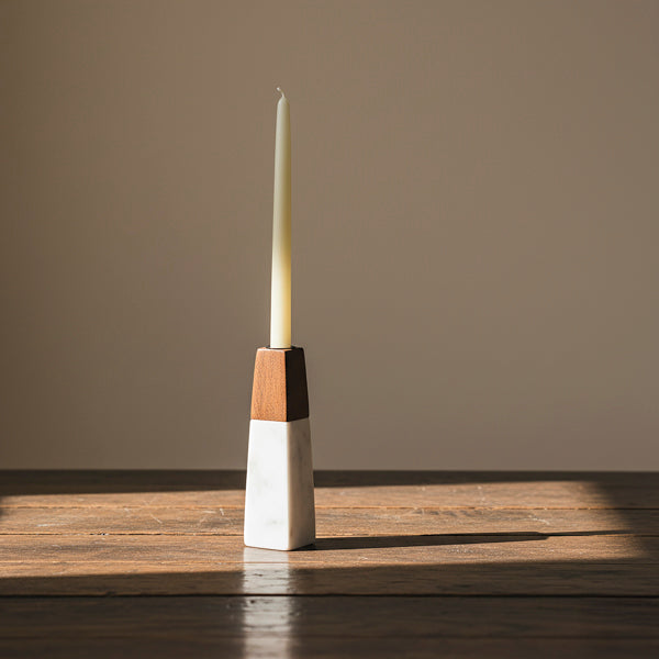 white marble candleholder styled on table with candle
