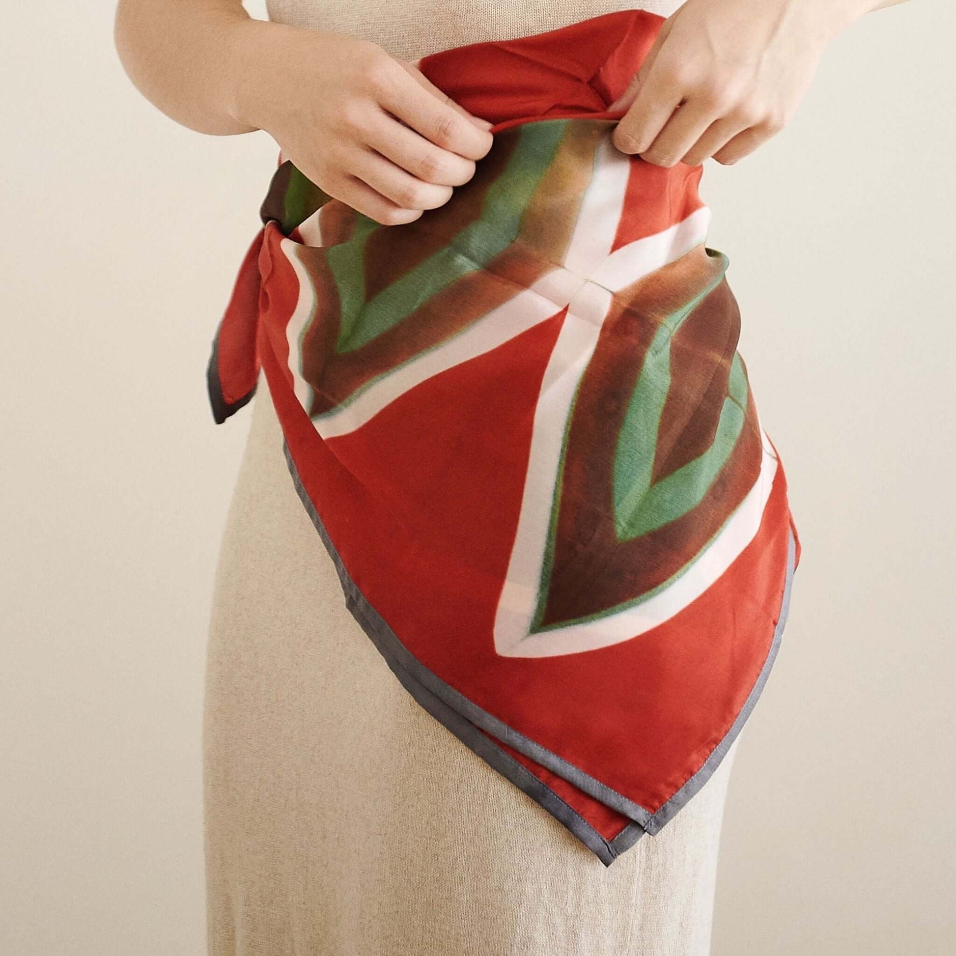 Fawn Square Silk Artisanal Scarf In Multicolor Hand Crafted Shibori Print styled and tied on a model.