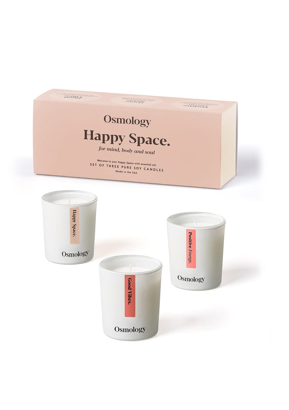 Osmology happy space gift set of three mini votive candles displayed next to product packaging on a yellow coloured background