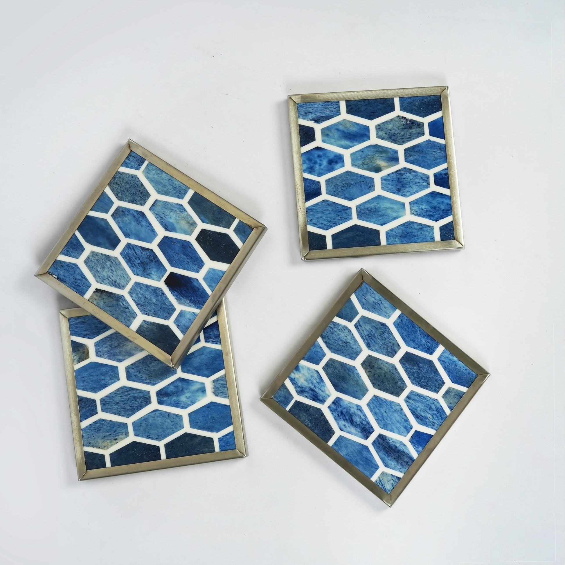 Top-down view of the Gramercy bone inlay coaster highlighting its smooth, hand-polished surface and deep blue artisanal finish.