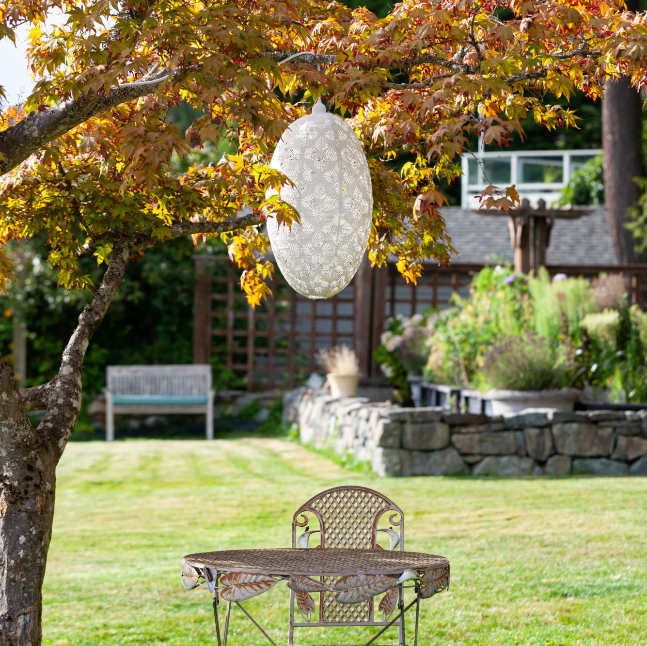 Soji Stella Nova Palm Pod Indoor Outdoor Tyvek Pendant Lamp in tree