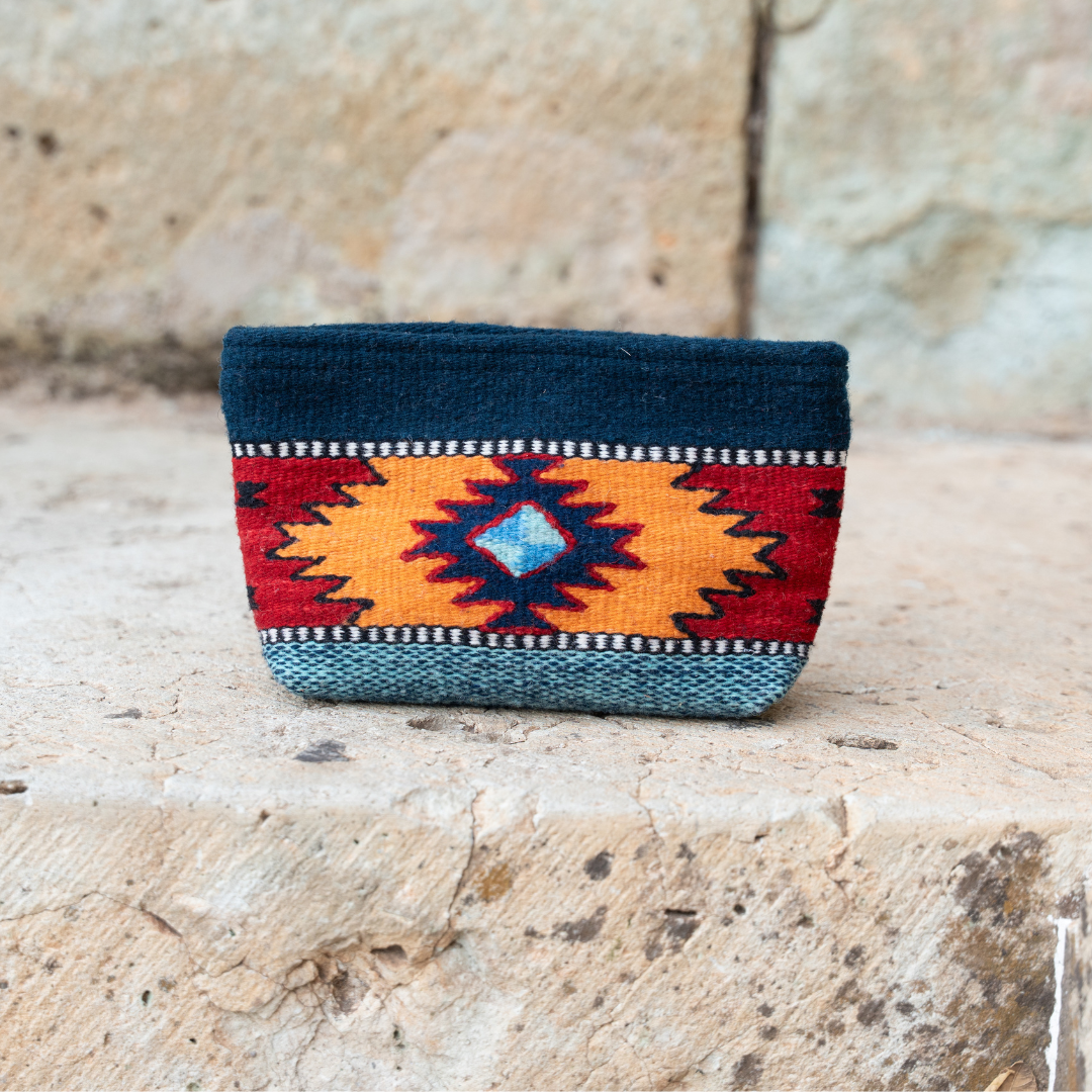 Handwoven pouch with abstract Zapotec arrow design in bold colors featuring internal pocket; perfect for makeup, wallet, or daily essentials.