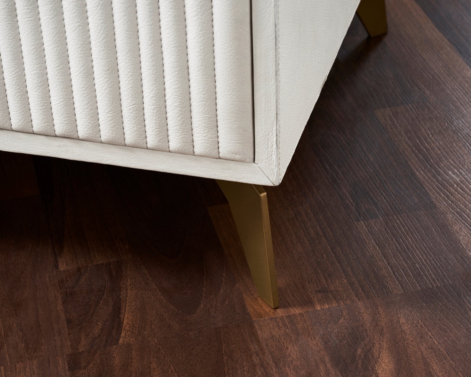 FN-5203-201828_7|Close-up view of the sophisticated white leather furniture featuring sleek gold tapered legs, showcasing luxury modern design.