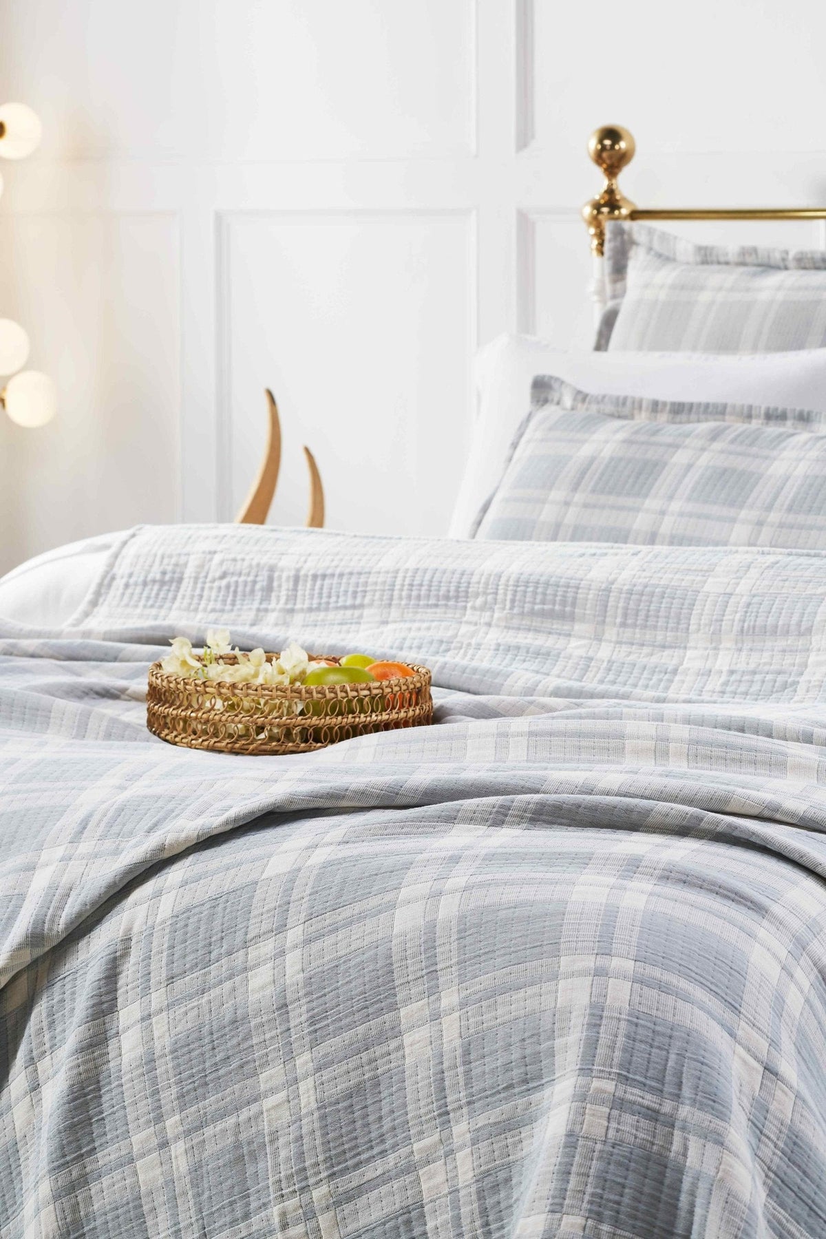 BT-117-11096_4|Cozy light blue and white plaid blanket styled on a bed, adding a tranquil and charming touch to bedroom decor.
